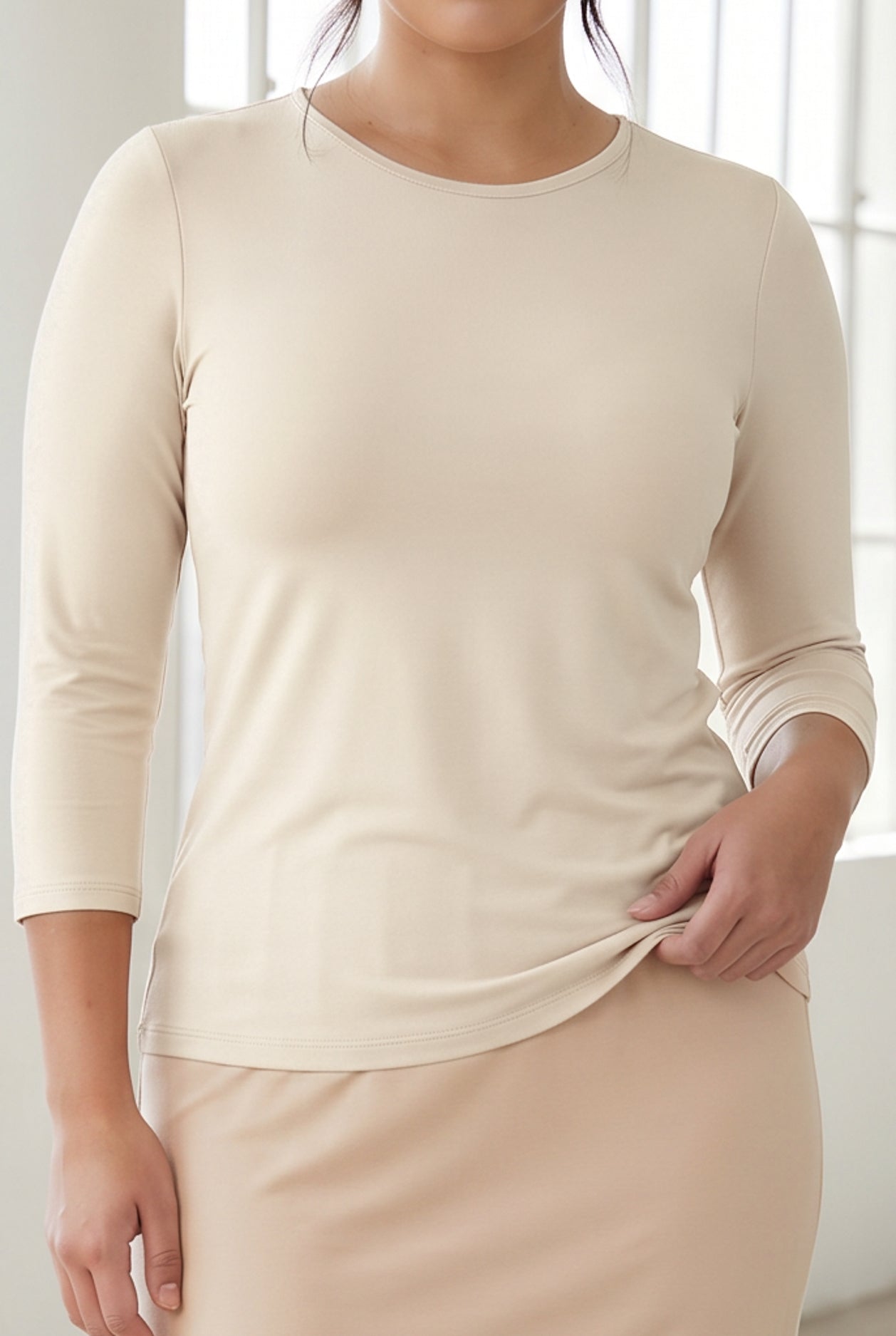 A close up shot of the essential tee in 3/4 length sleeves.
