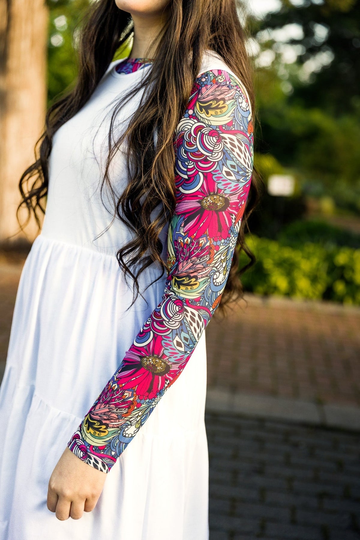 Close up picture of a leopard print sleeve and a floral print bodice dress