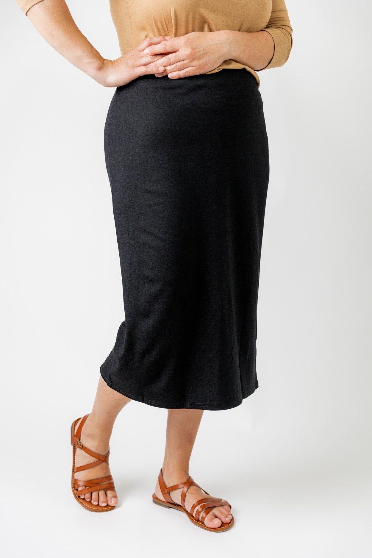 A modest, midi length skirt with no slits. 