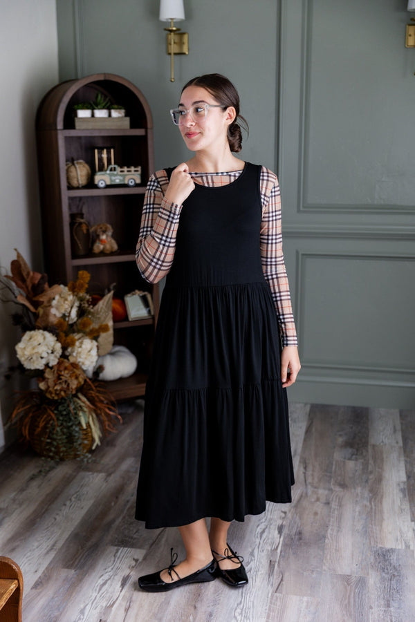 A women wearing a maxi length dress that works well for a church outfit. 