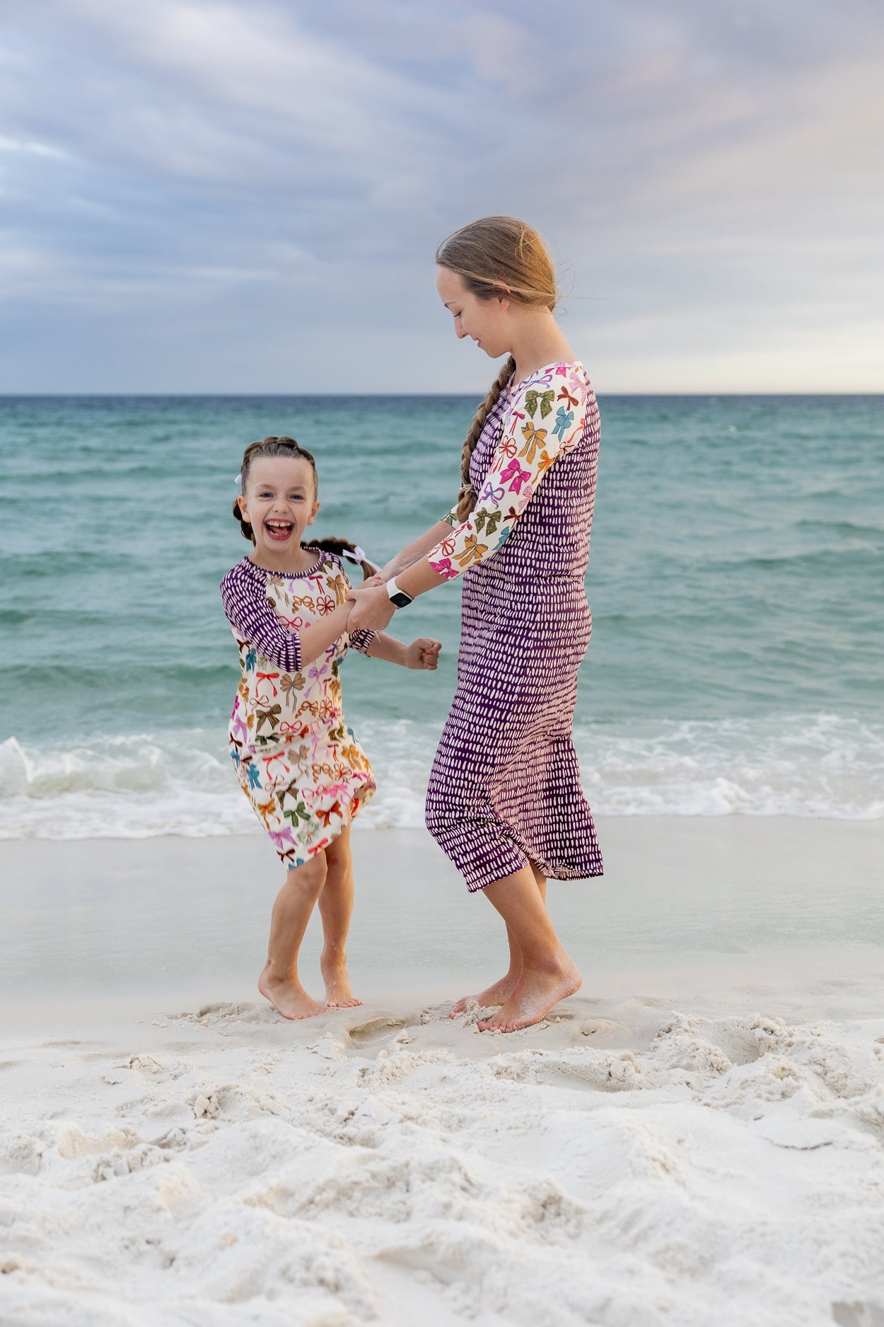 A picture of a women and a girl wearing modest swim dresses.