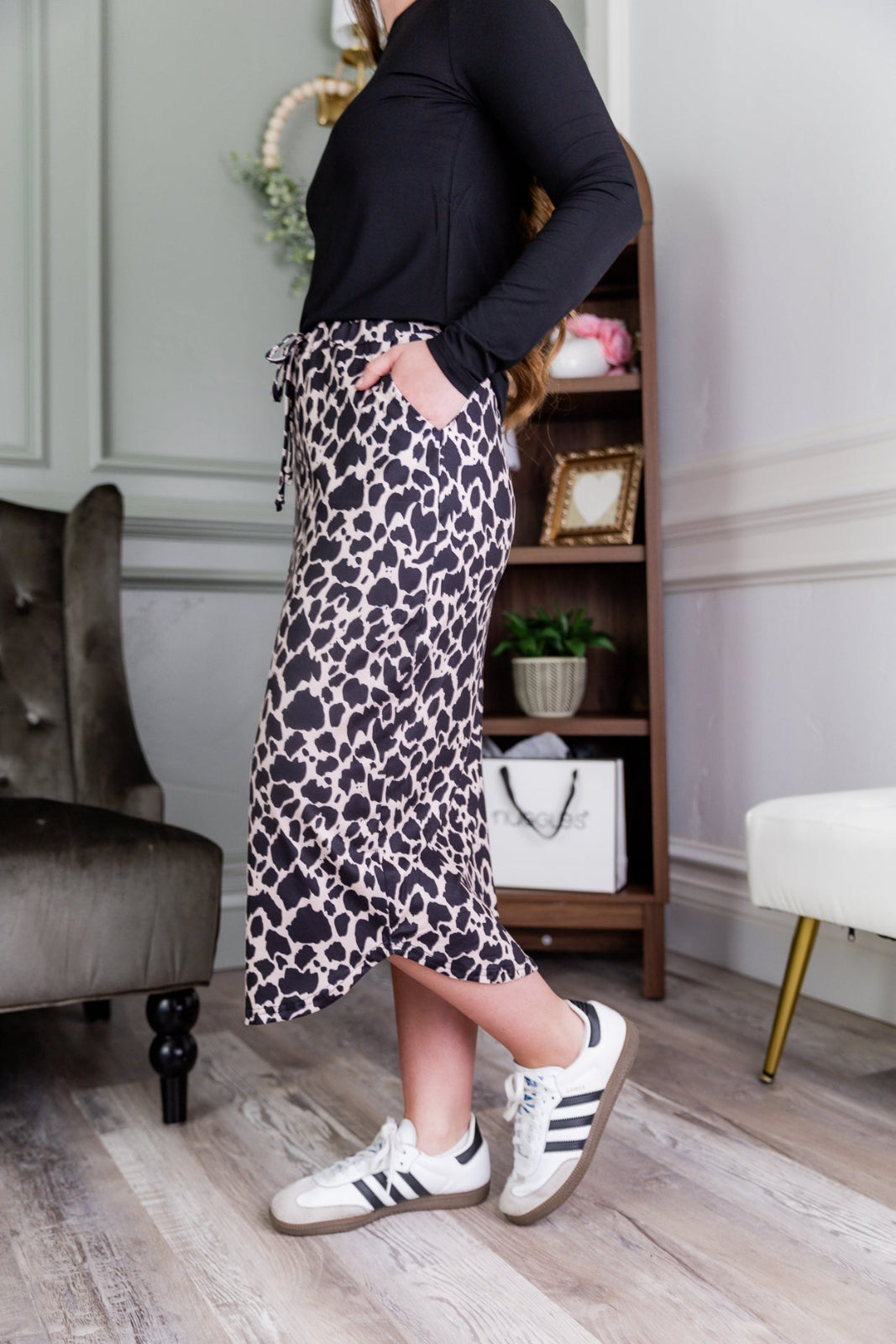 A longer length of a drawstring skirt with a pocket.