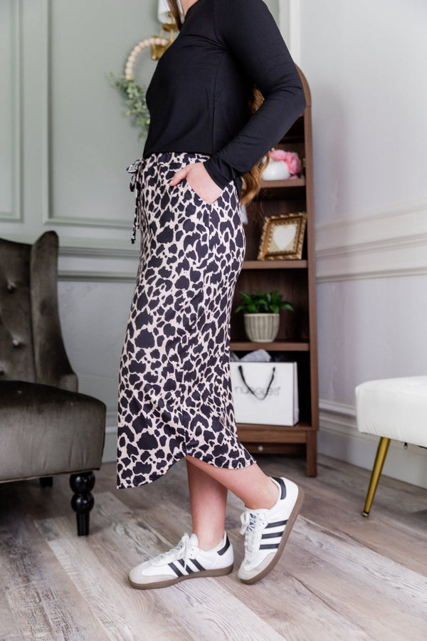 A longer length of a drawstring skirt with a pocket.