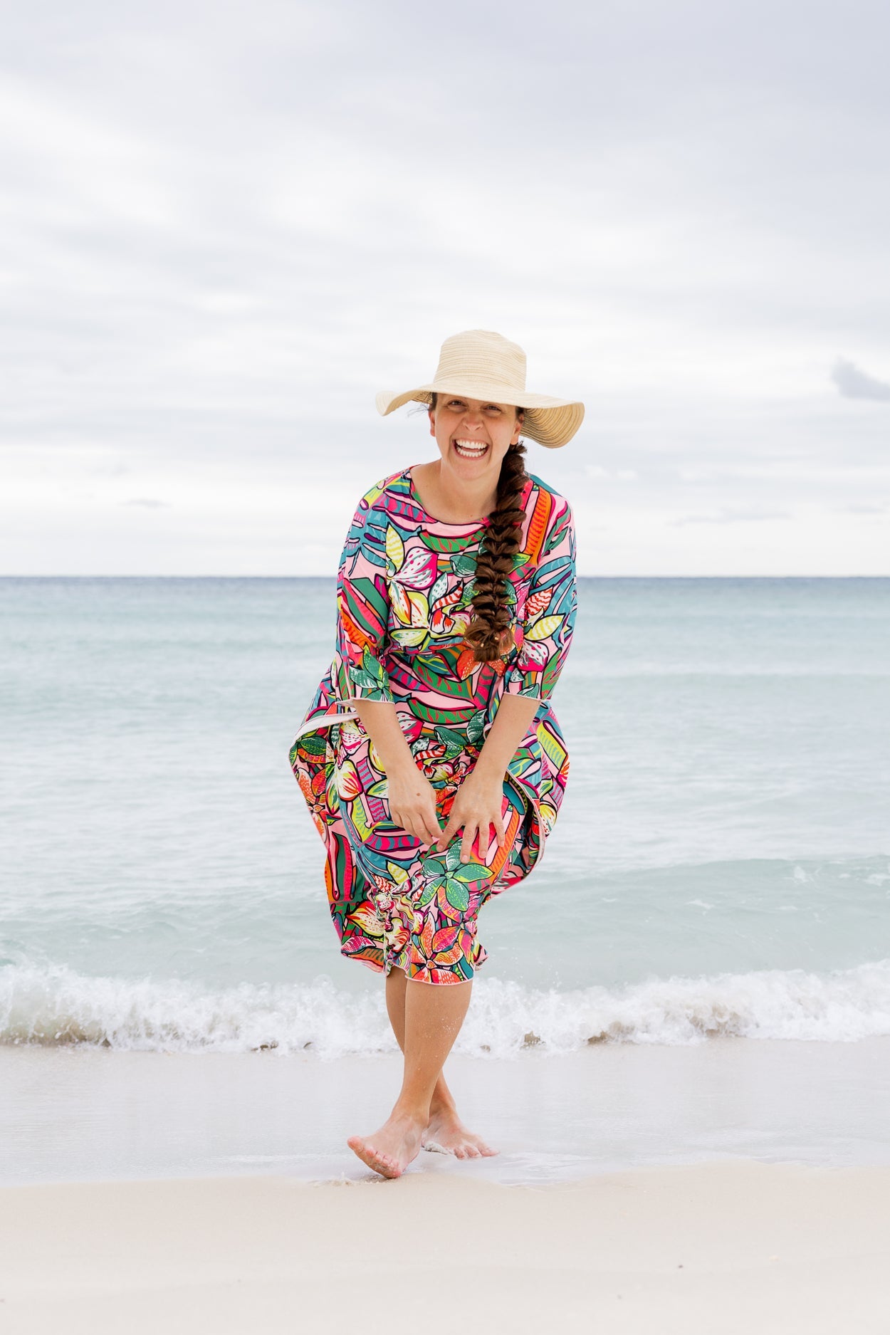 The Carlie Swim Dress in a bold print at the beach.