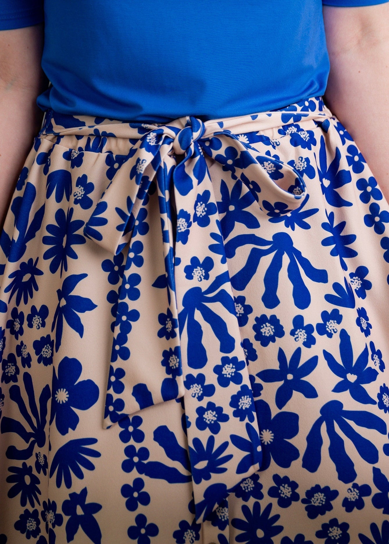 A modest midi length skirt with a bow waist tie.