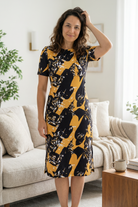 Model wearing Modest Nuggles® Aviva Dress in Golden Drift