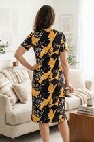 Model wearing Modest Nuggles® Aviva Dress in Golden Drift