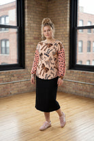 Model wearing the Nuggles® Bryauna Top in Love & Leopard