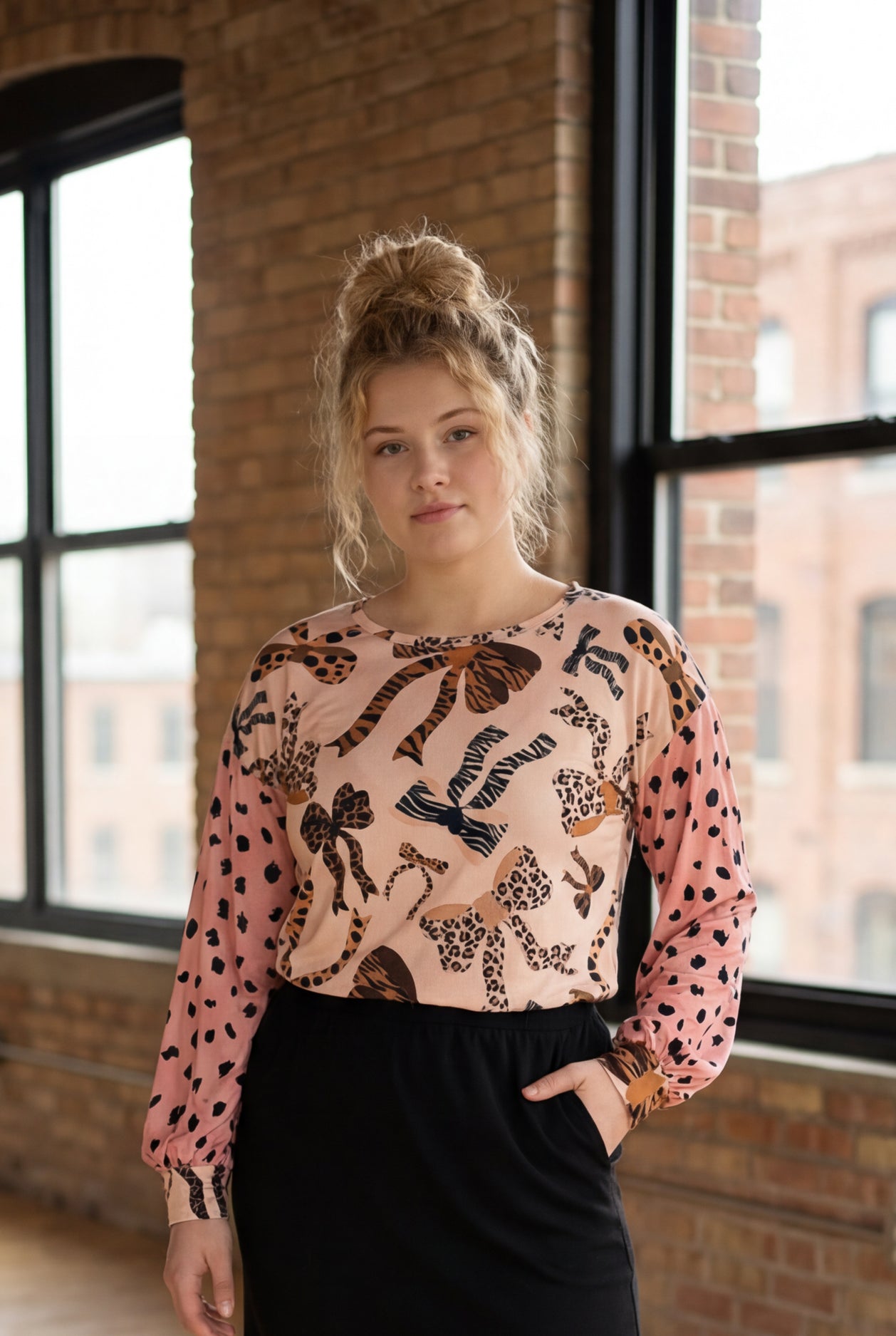 Model wearing Nuggles® Bryauna Top in Love & Leopard