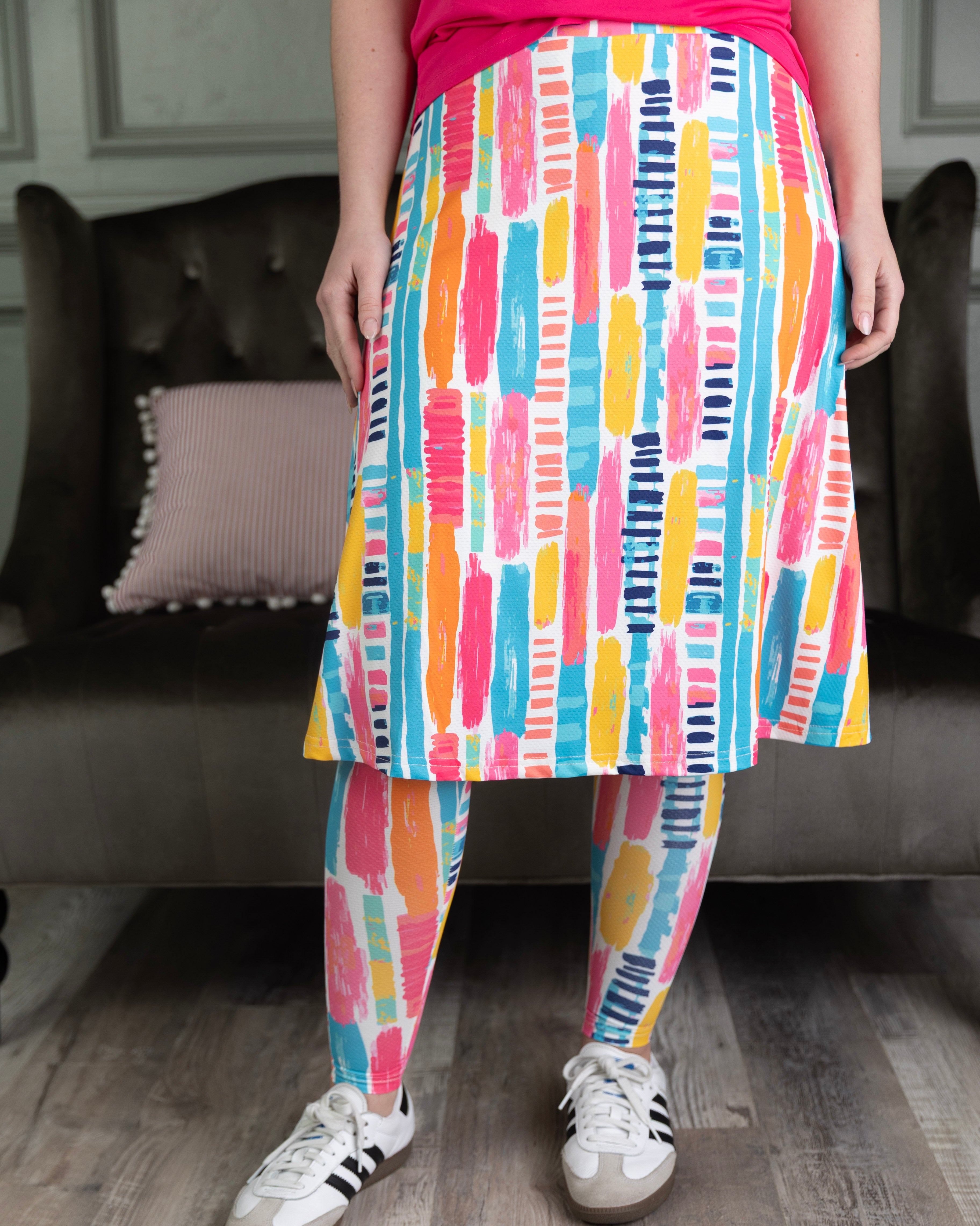 Model wearing Nuggles® Tilly Sport Skirt in Color Splash