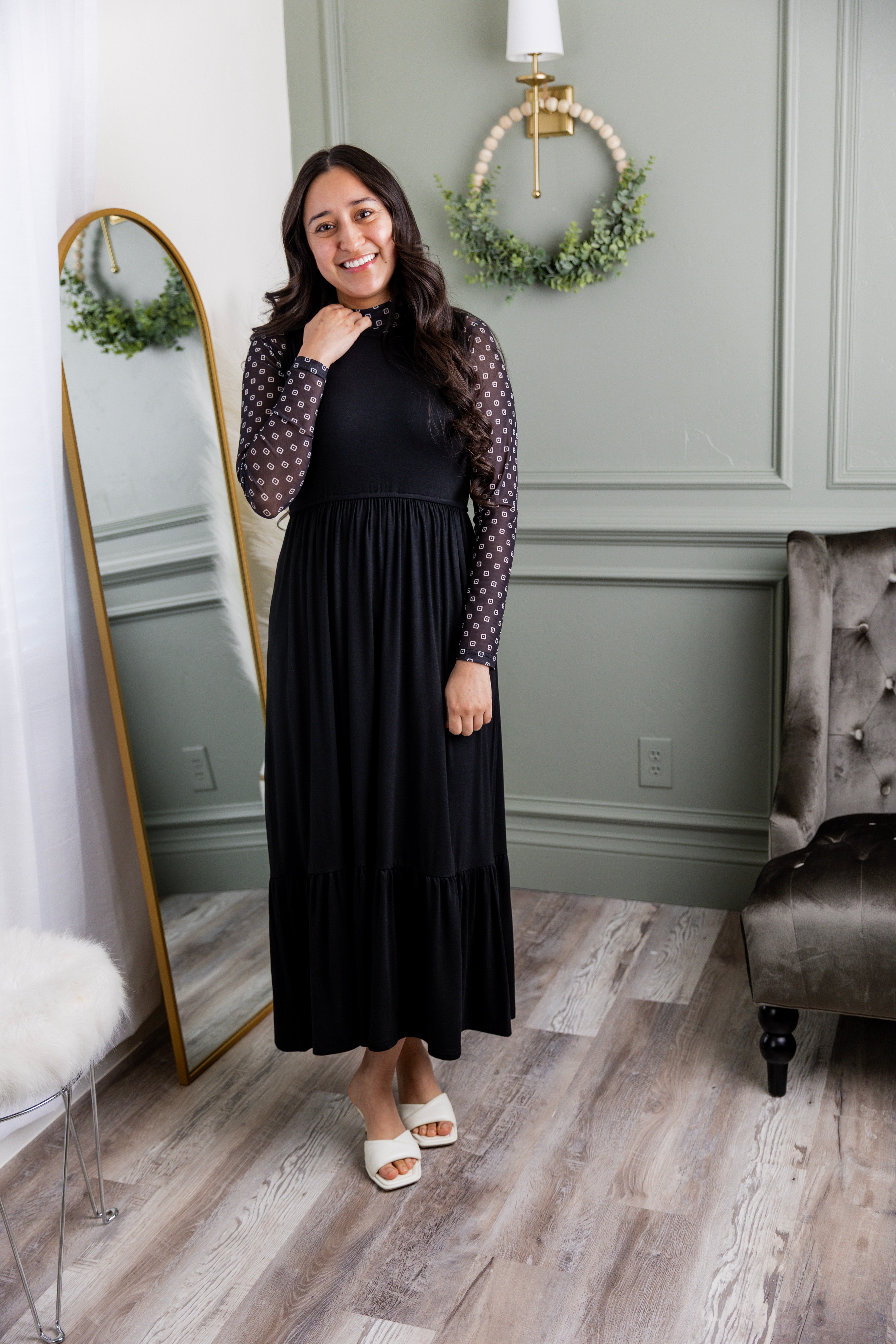 Model wearing the Nuggles® Riley Dress in Black