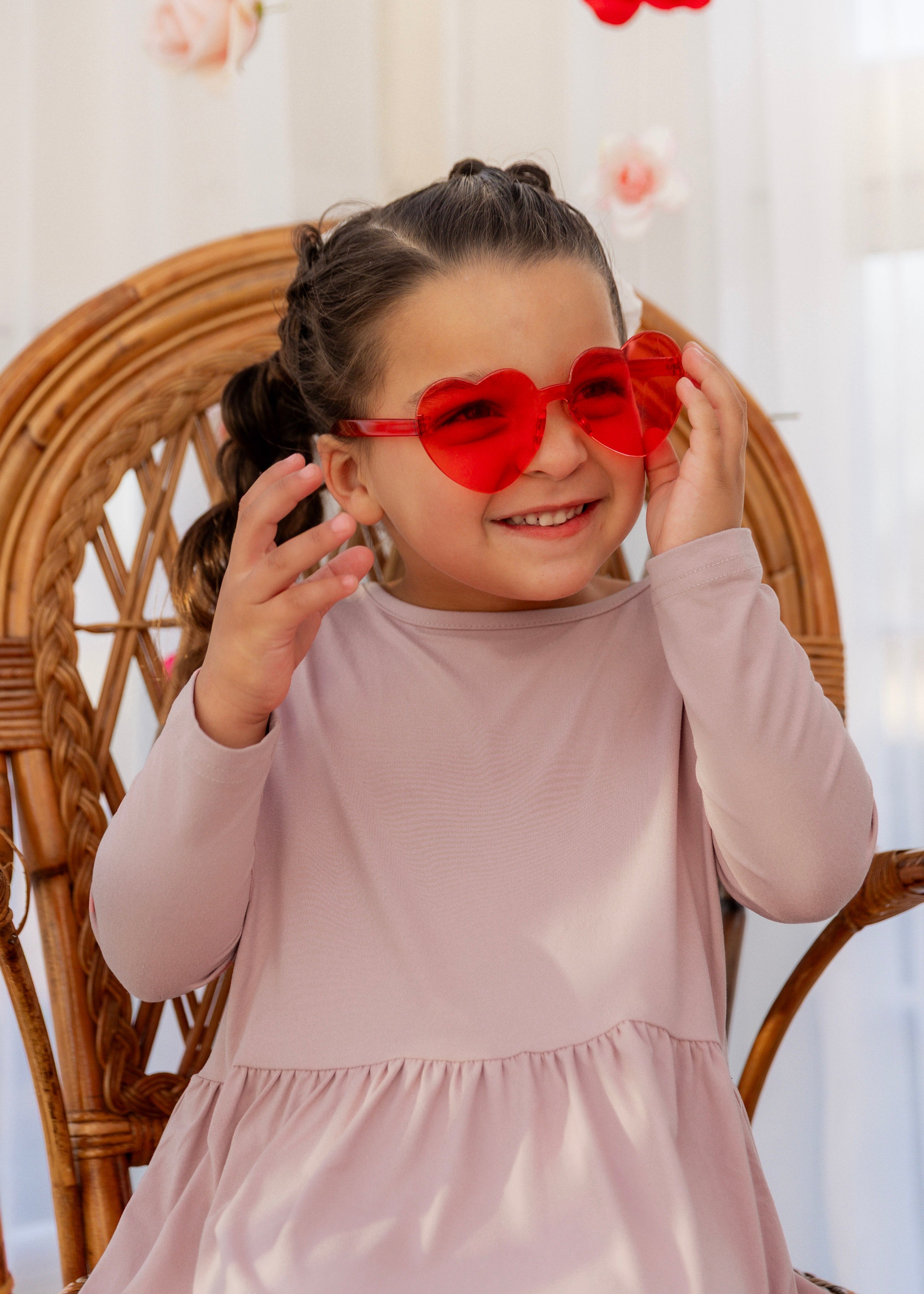 Model wearing the Nuggles® Girls' Farah Dress in Baby Pink