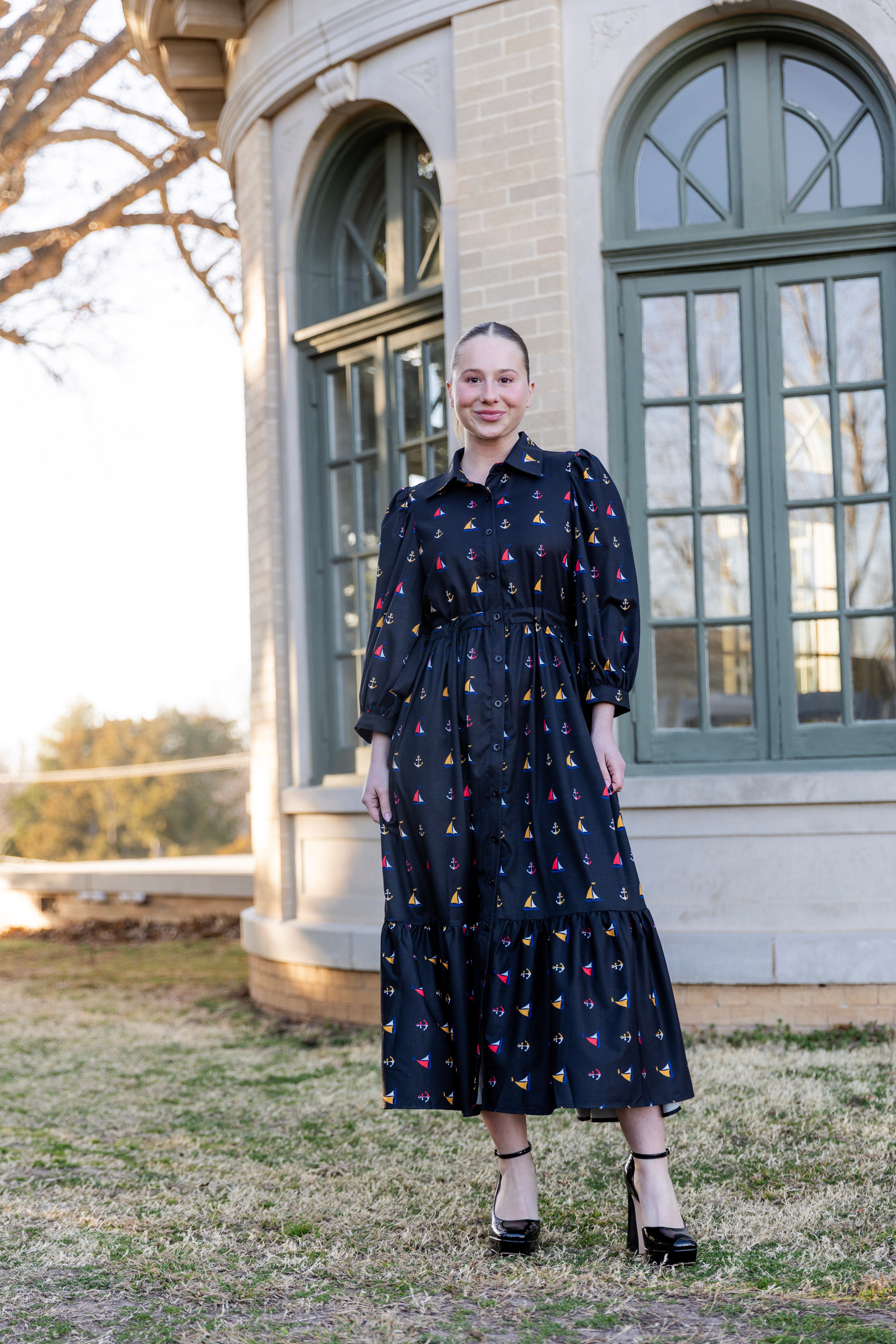 Model wearing the Nuggles® Leila Dress in Tiny Skipper