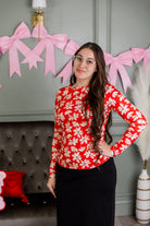 Model wearing Nuggles® Essential Long Sleeve Tee in Red Petal Party