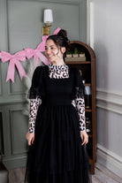 Model wearing Nuggles® Mesh Tee top in Snow Leopard