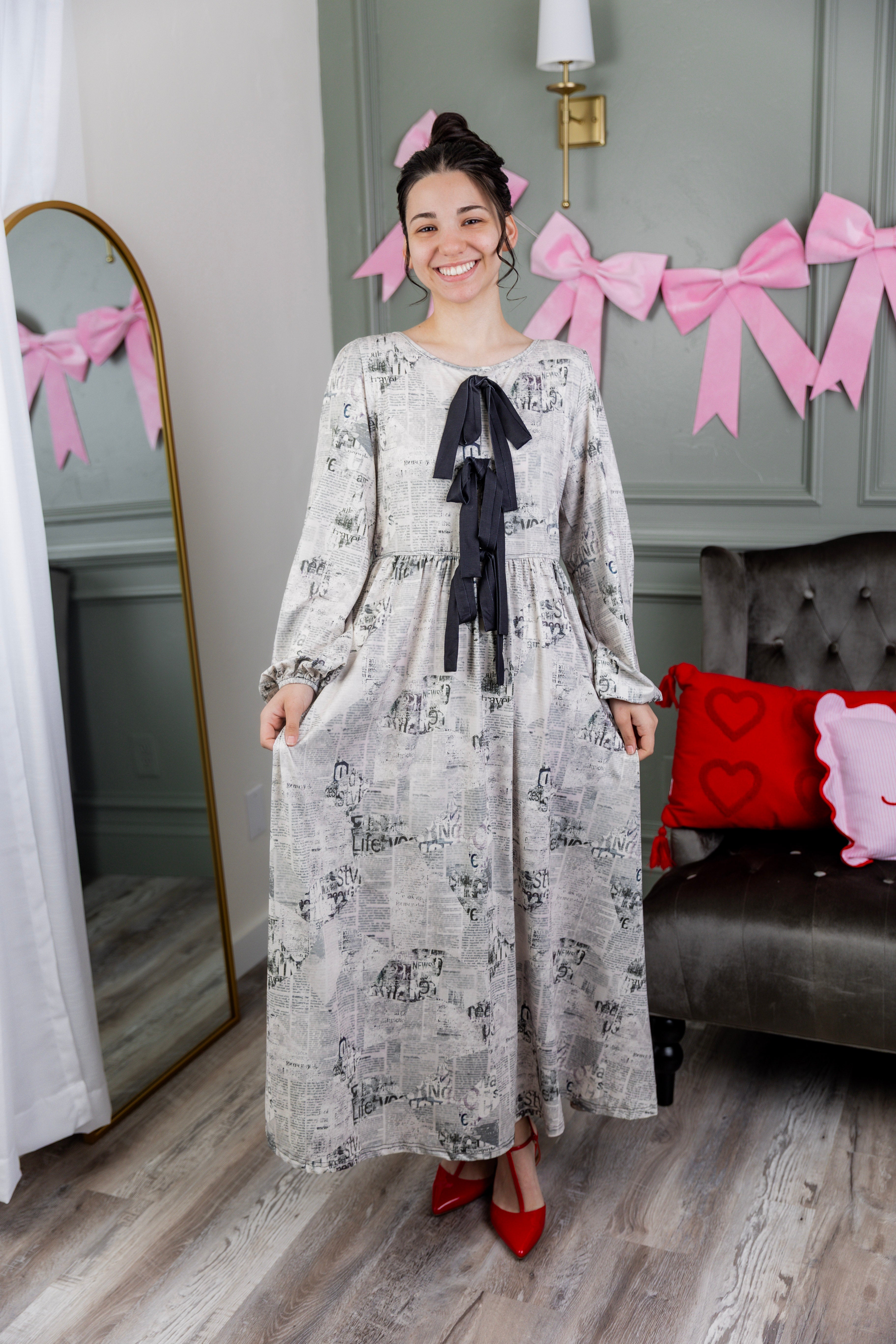 Model wearing the Nuggles® Addison Dress in Whispering Headlines