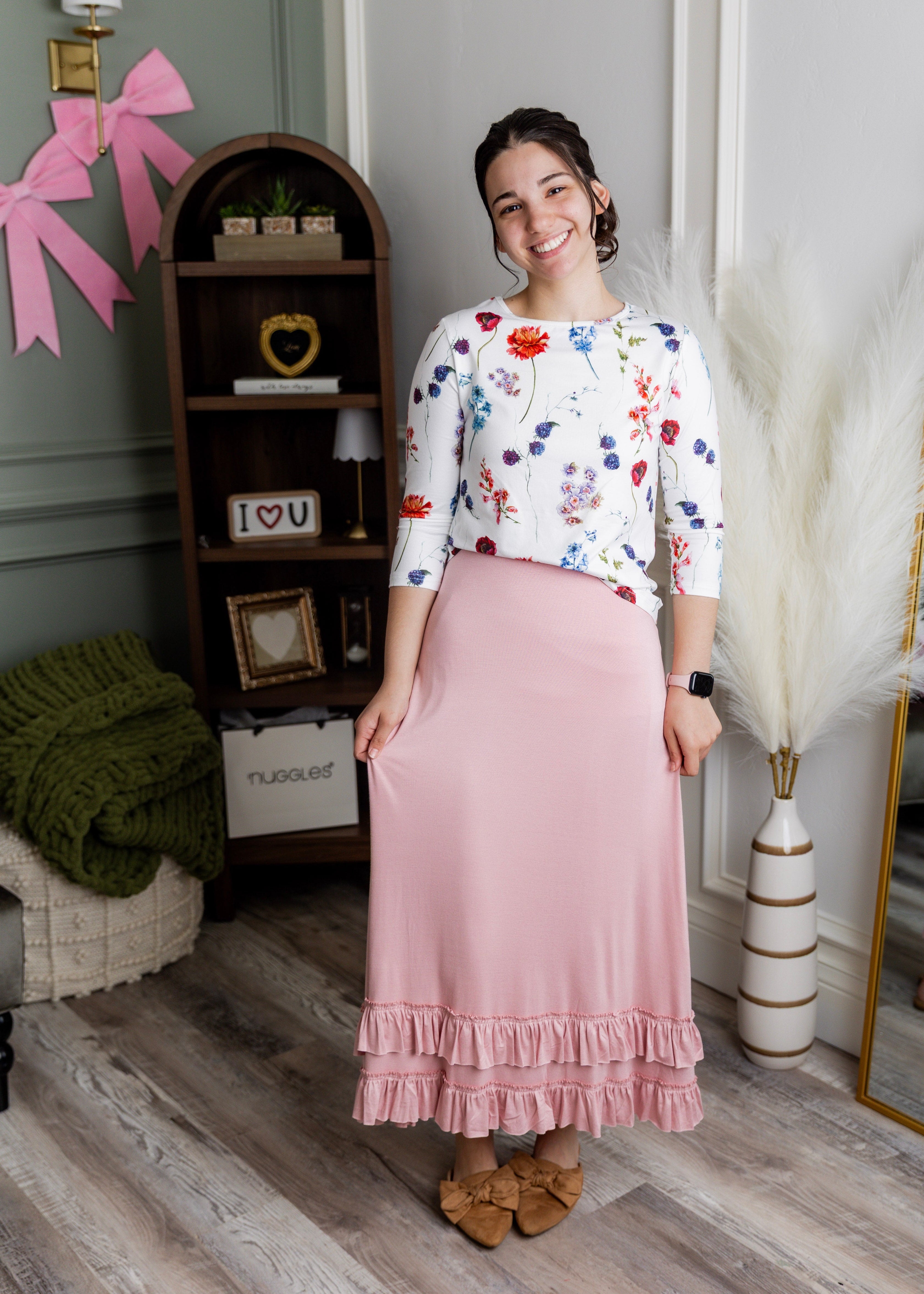 Model wearing Nuggles® Callie Skirt in Baby Pink Modest skirt