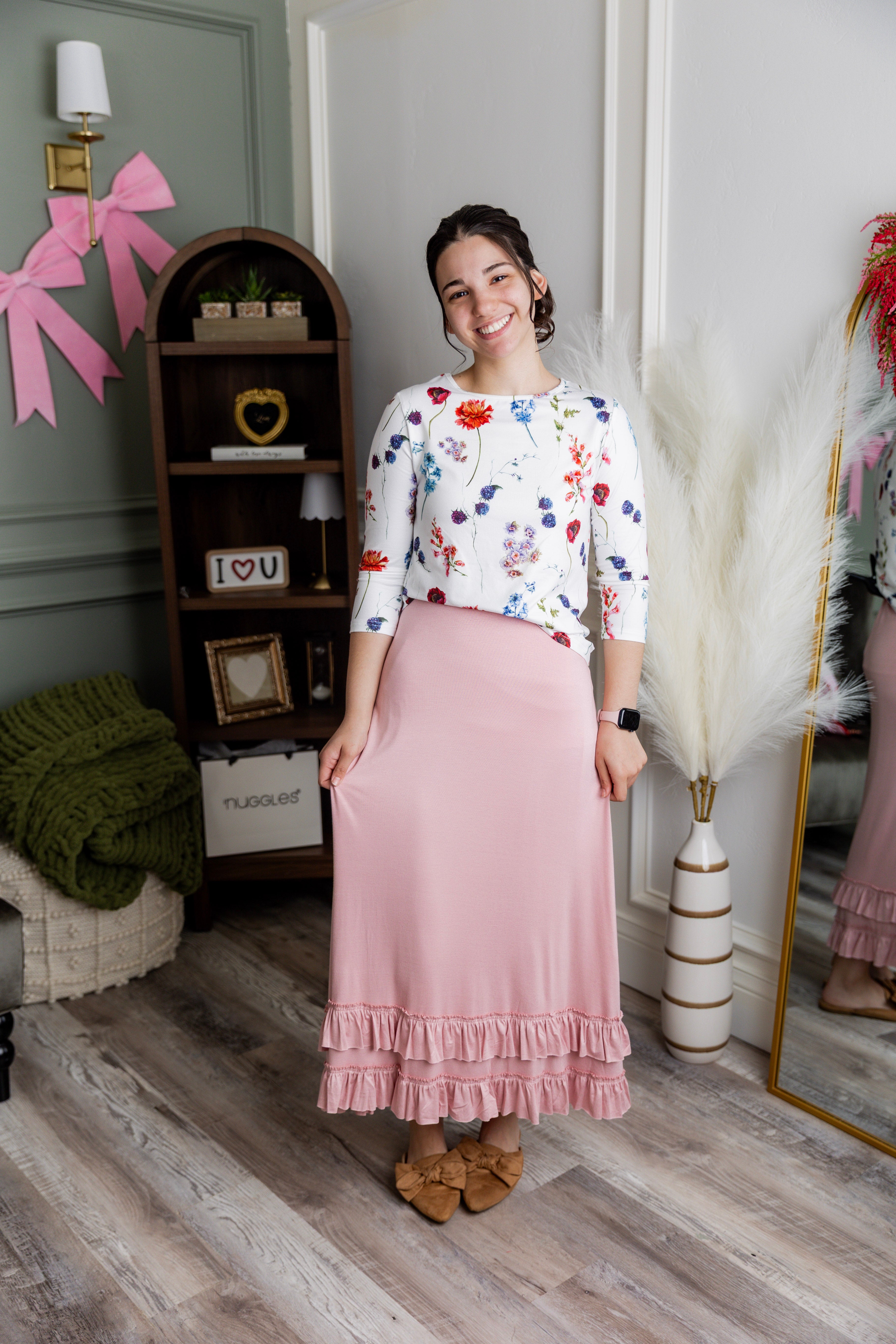 Model wearing Nuggles® Callie Skirt in Baby Pink Modest skirt
