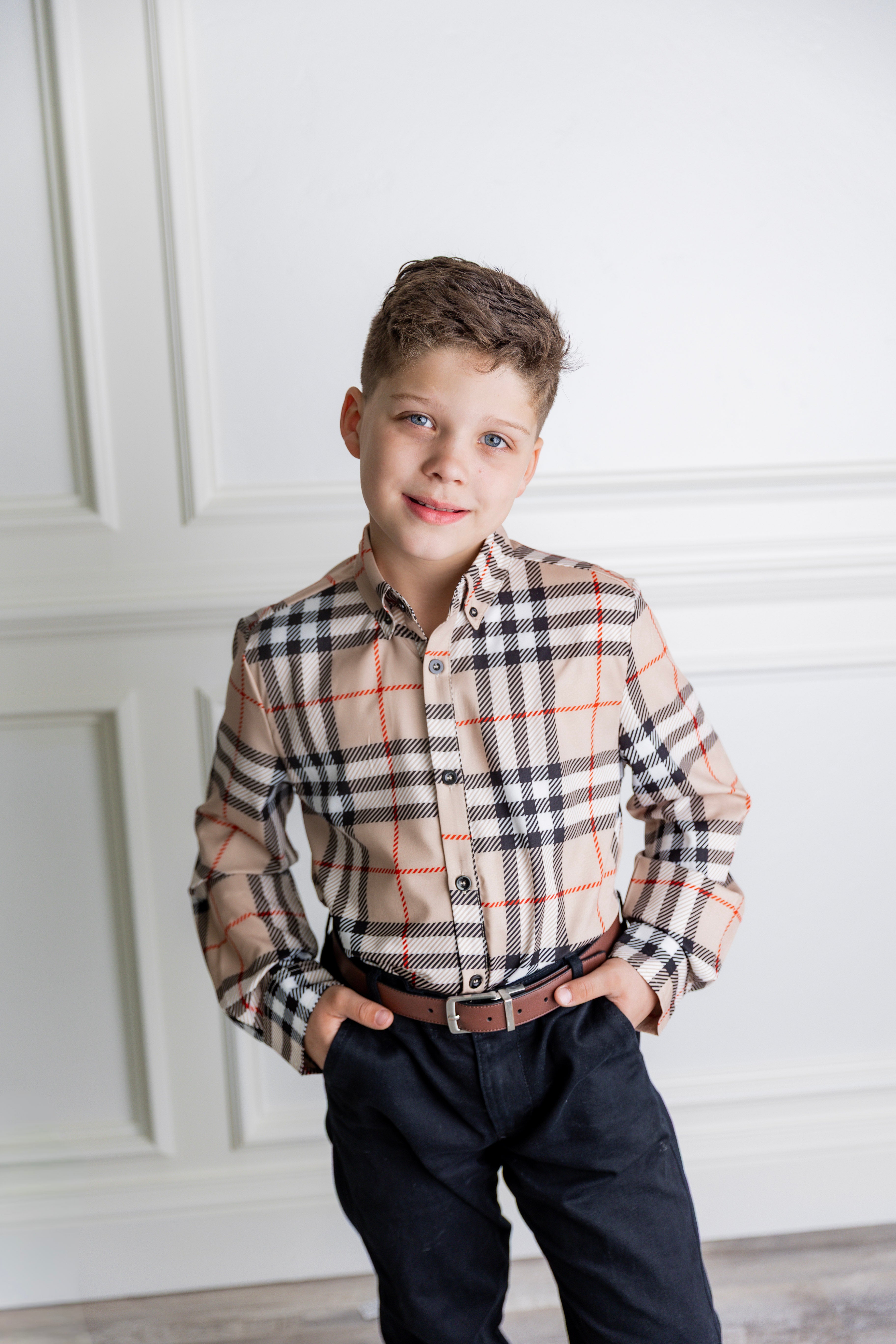 Model wearing Nuggles® Boys' Button Down Shirt Sand Plaid