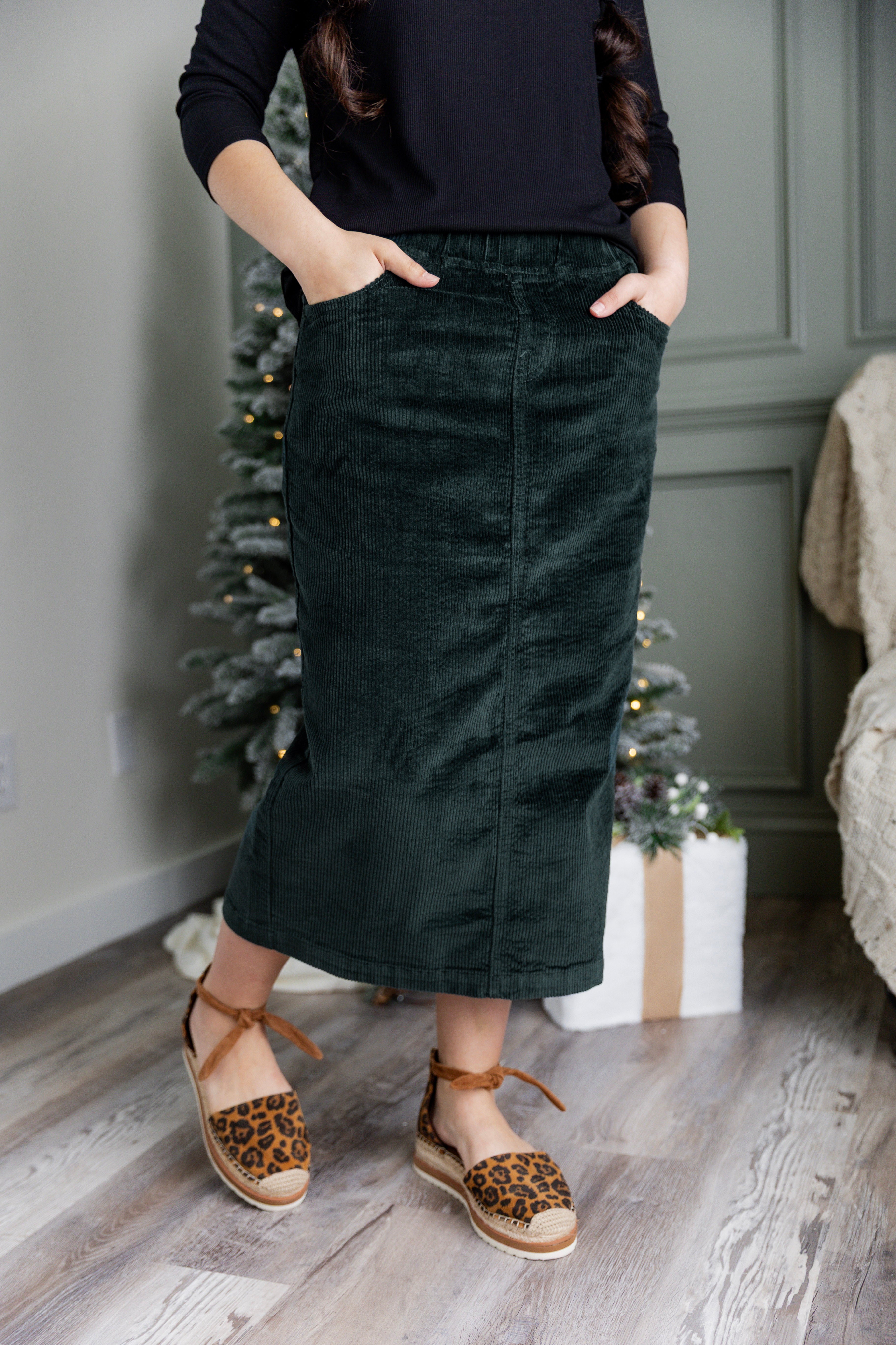 Model wearing Nuggles® 25-inch corduroy skirt