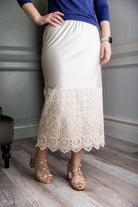 Model wearing our modest Nuggles® 31" crochet lace slip in Beige