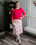 Model wearing Nuggles® Tilly Sport Skirt in Cherry Sweet