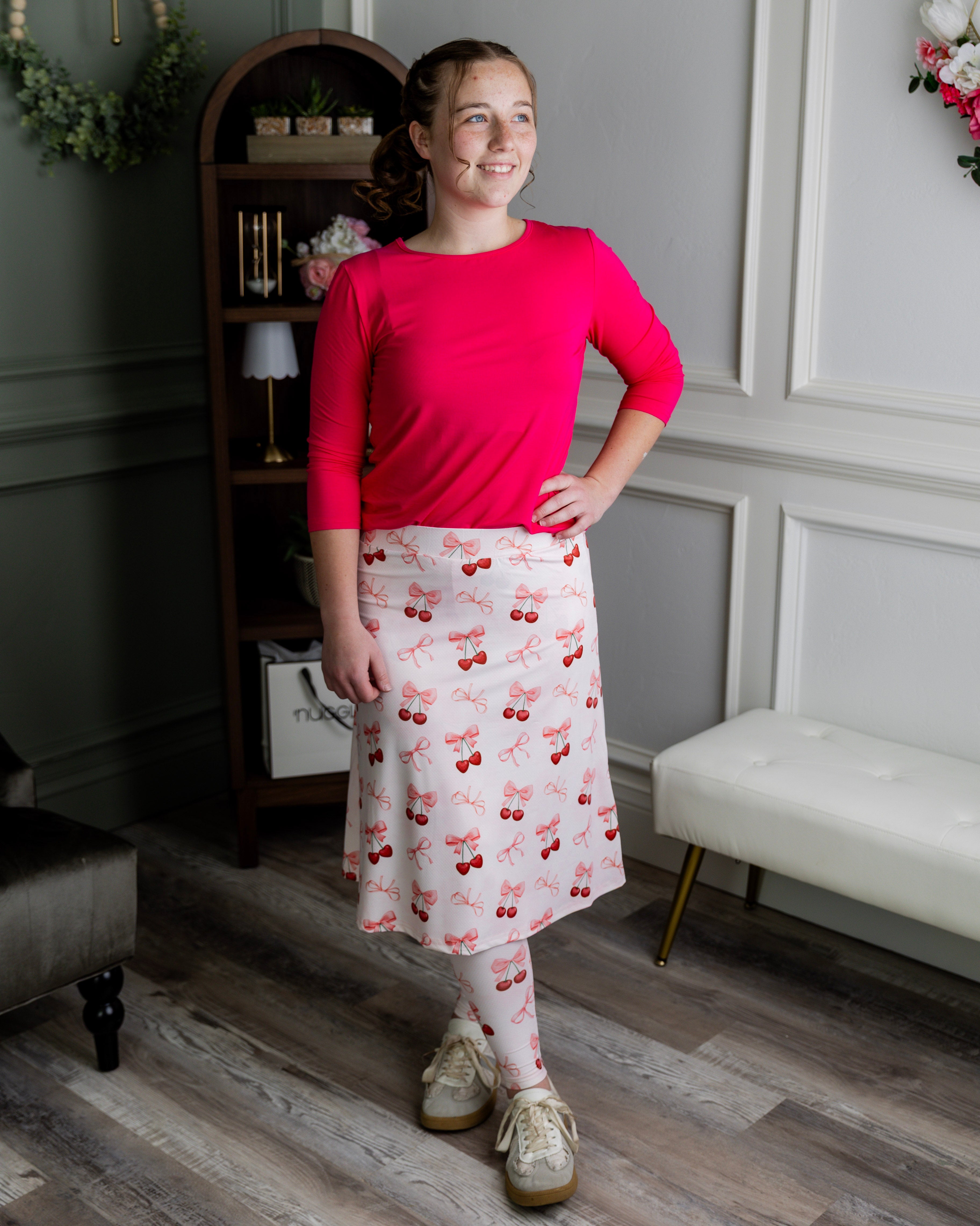 Model wearing Nuggles® Tilly Sport Skirt in Cherry Sweet