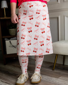 Model wearing Nuggles® Tilly Sport Skirt in Cherry Sweet