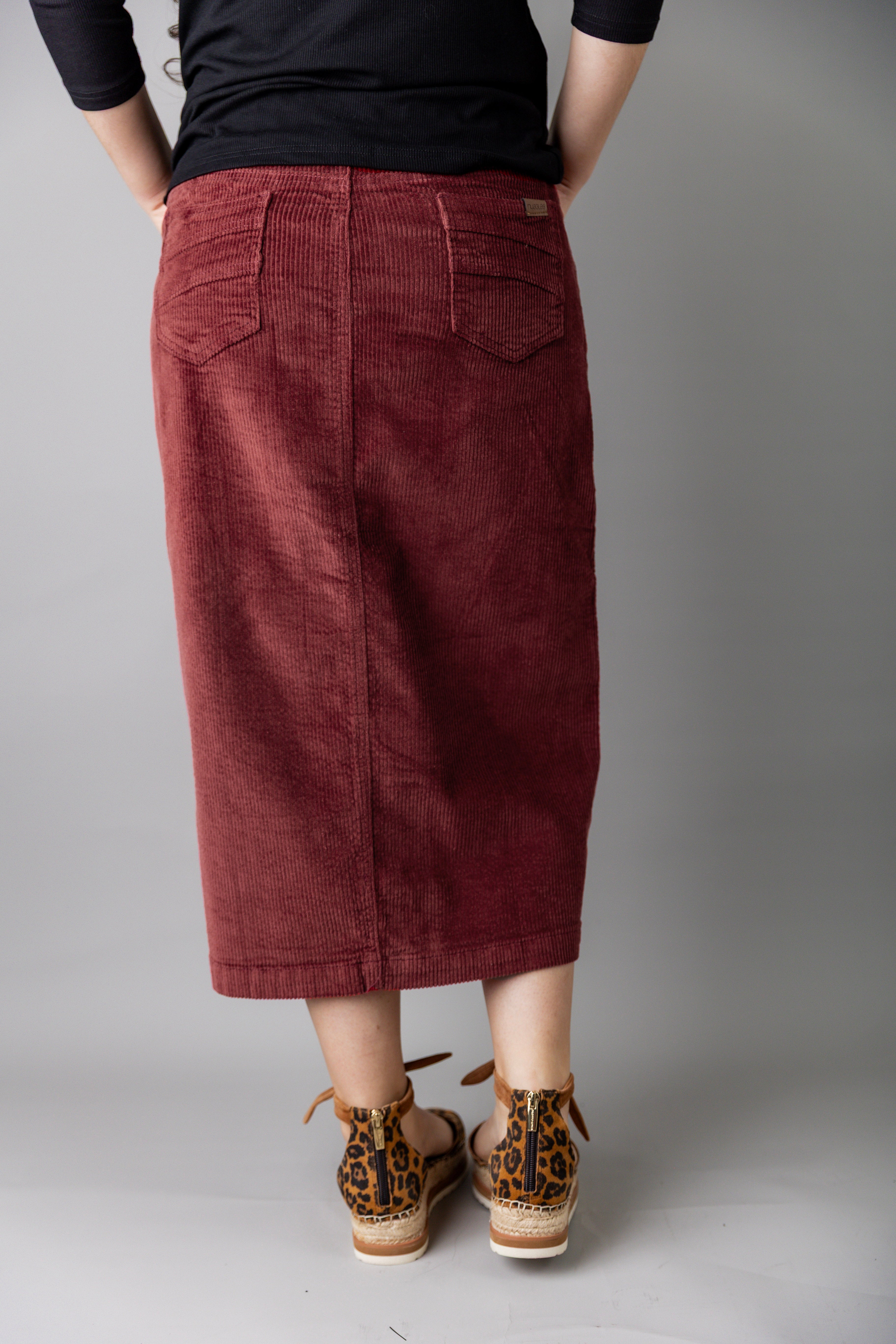 Model wearing Nuggles® 31-inch corduroy skirt