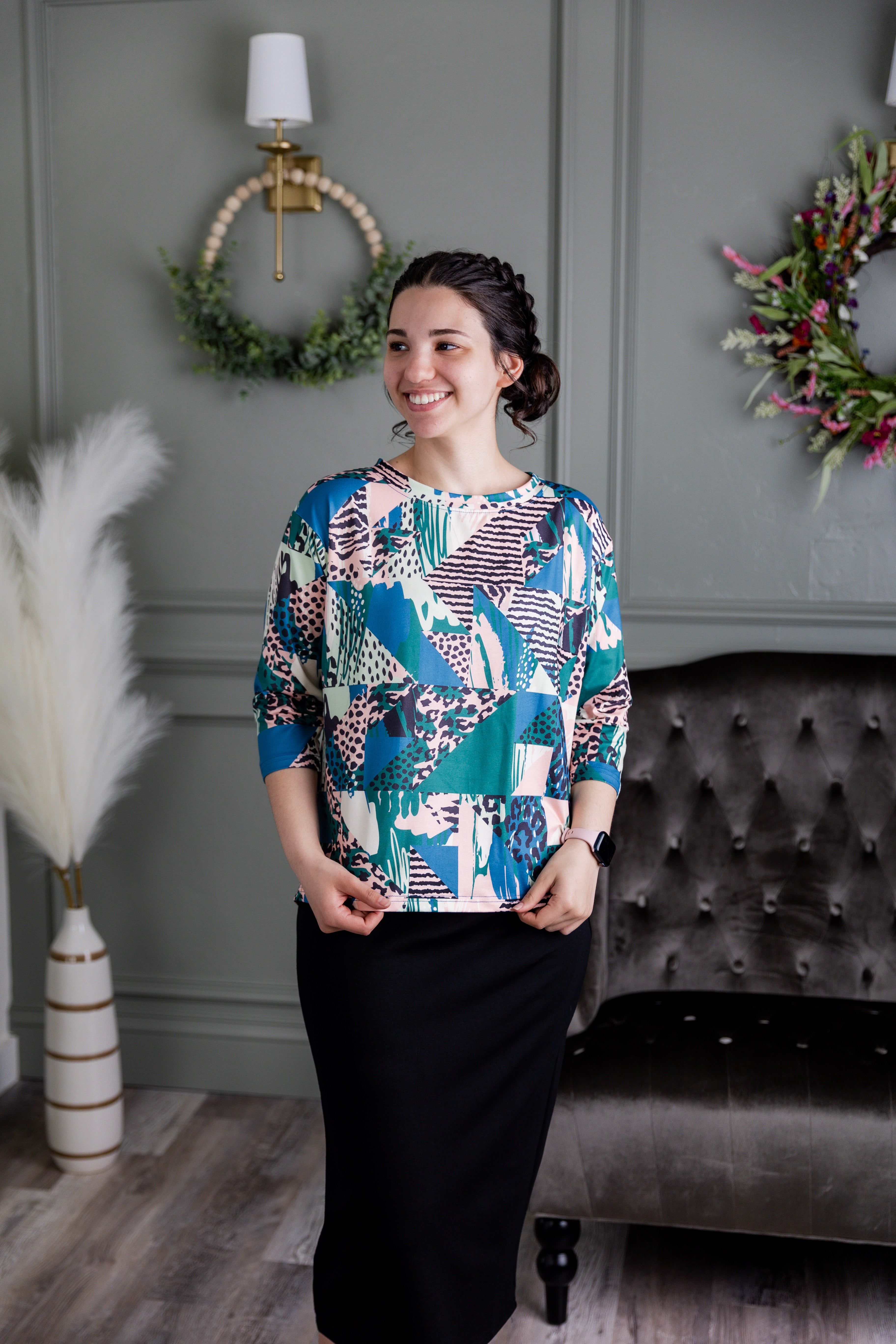 Model wearing the Nuggles® Lucia Top in Neon Boardwalk