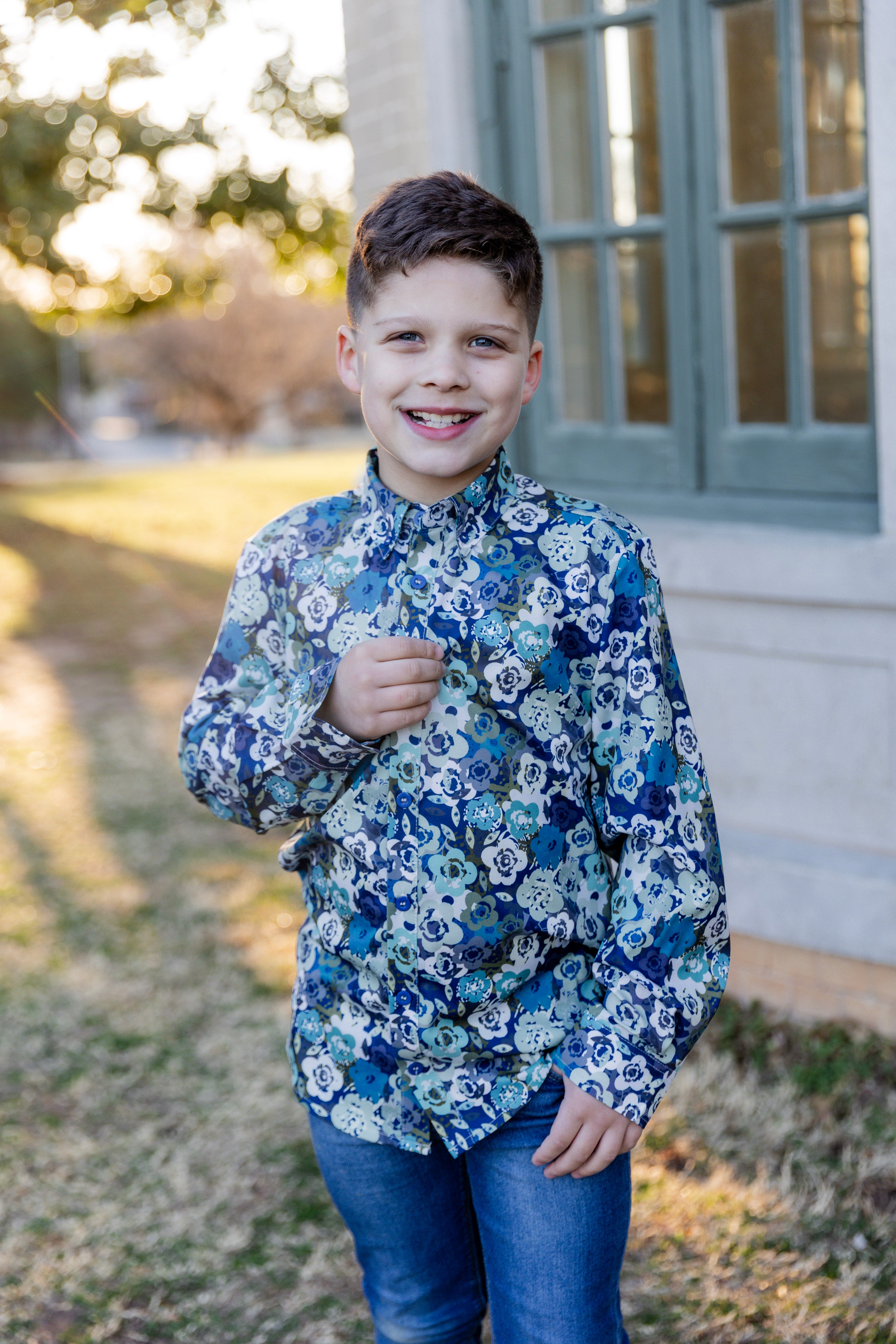 Model wearing Nuggles® Boys' Button Down Shirt Storm Brush