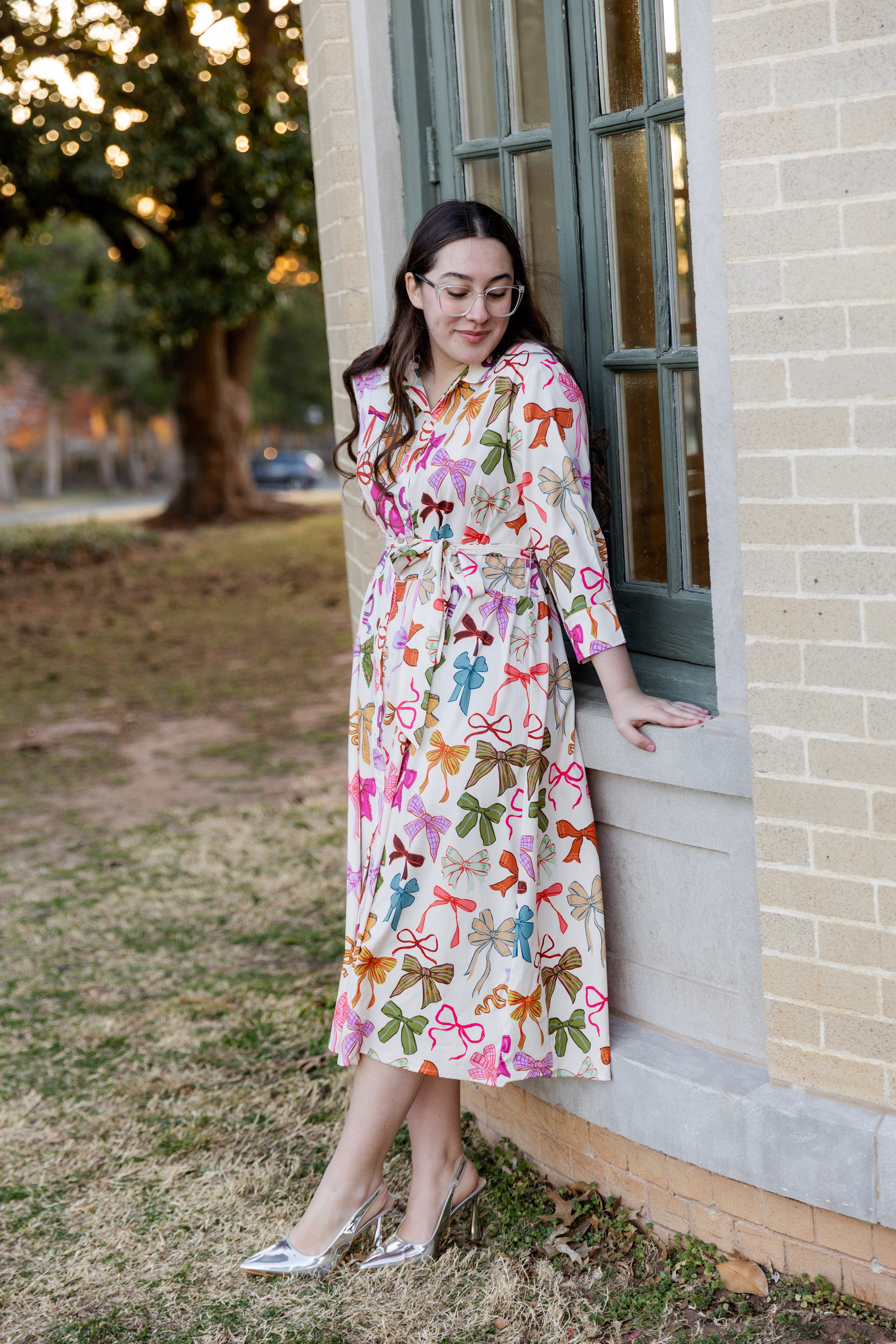 Model wearing the Nuggles® Rachel Dress in Bow Garden