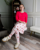 Model wearing Nuggles® Tilly Sport Skirt in Cherry Sweet