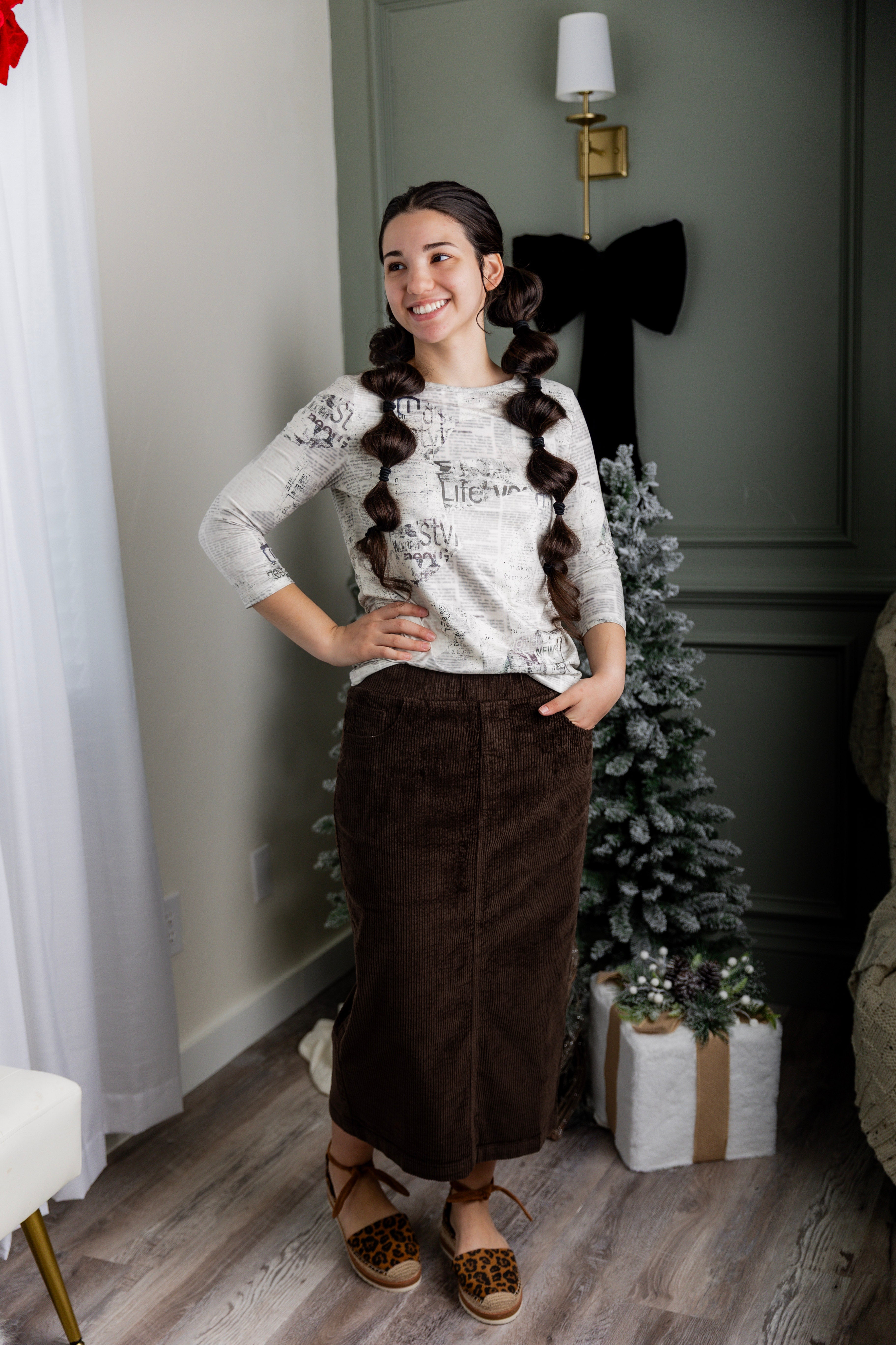 Model wearing Nuggles® 31-inch corduroy skirt