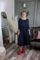 Model wearing Nuggles® Nova Dress in Navy