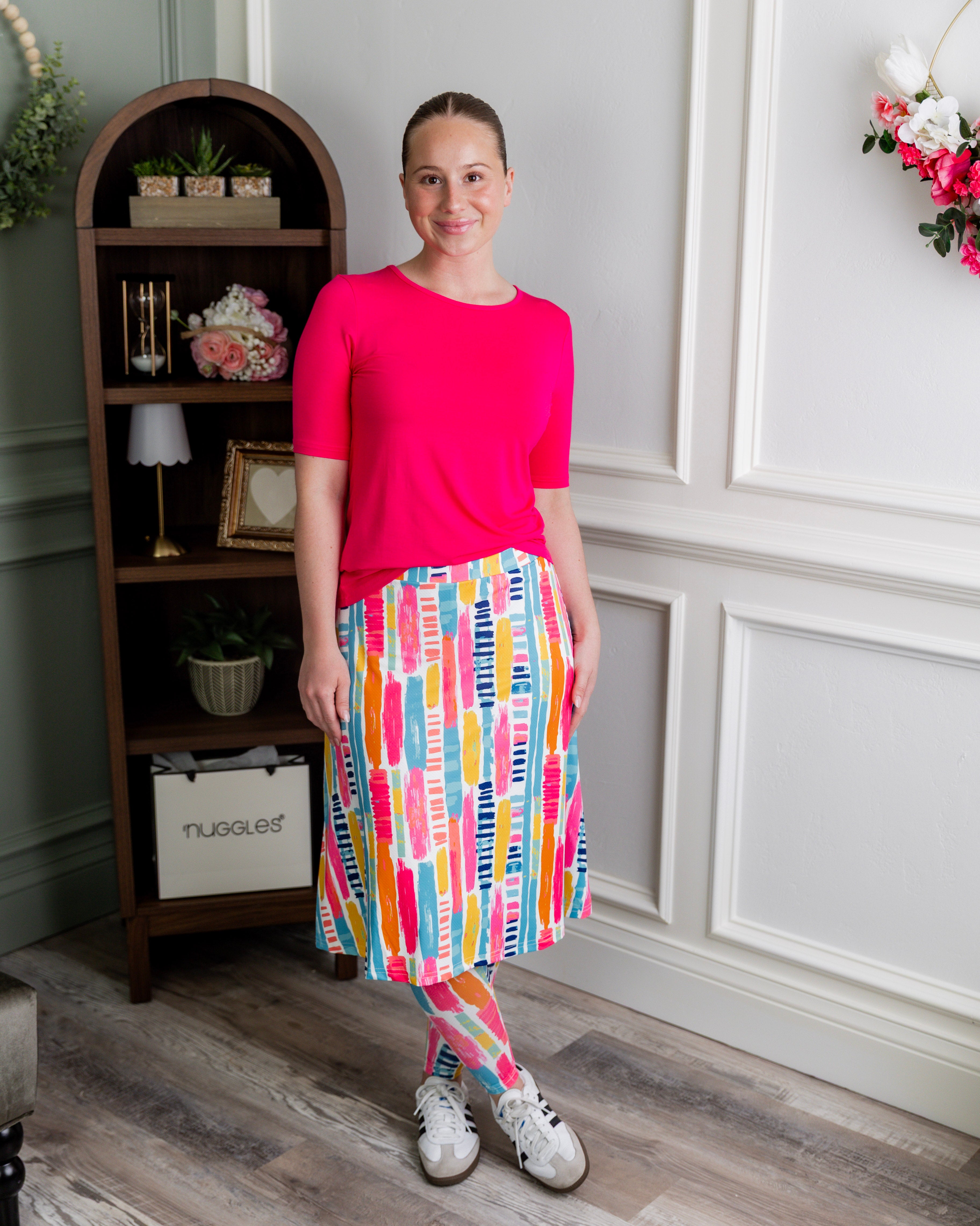Model wearing Nuggles® Tilly Sport Skirt in Color Splash