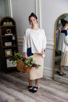 Model wearing the Nuggles® Keegan Top in Dewdrop Ivory floral print modest boutique top