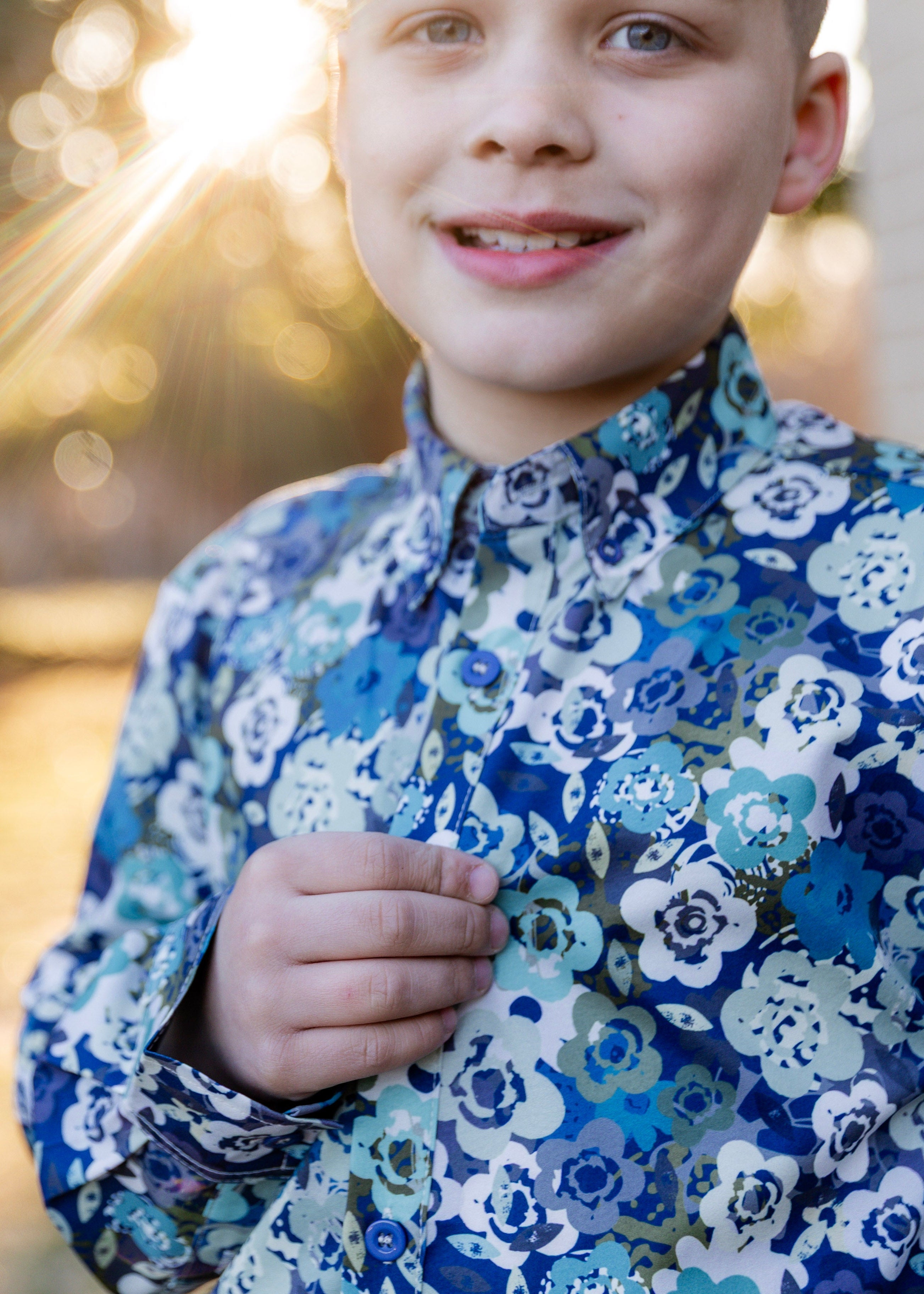 Model wearing Nuggles® Boys' Button Down Shirt Storm Brush