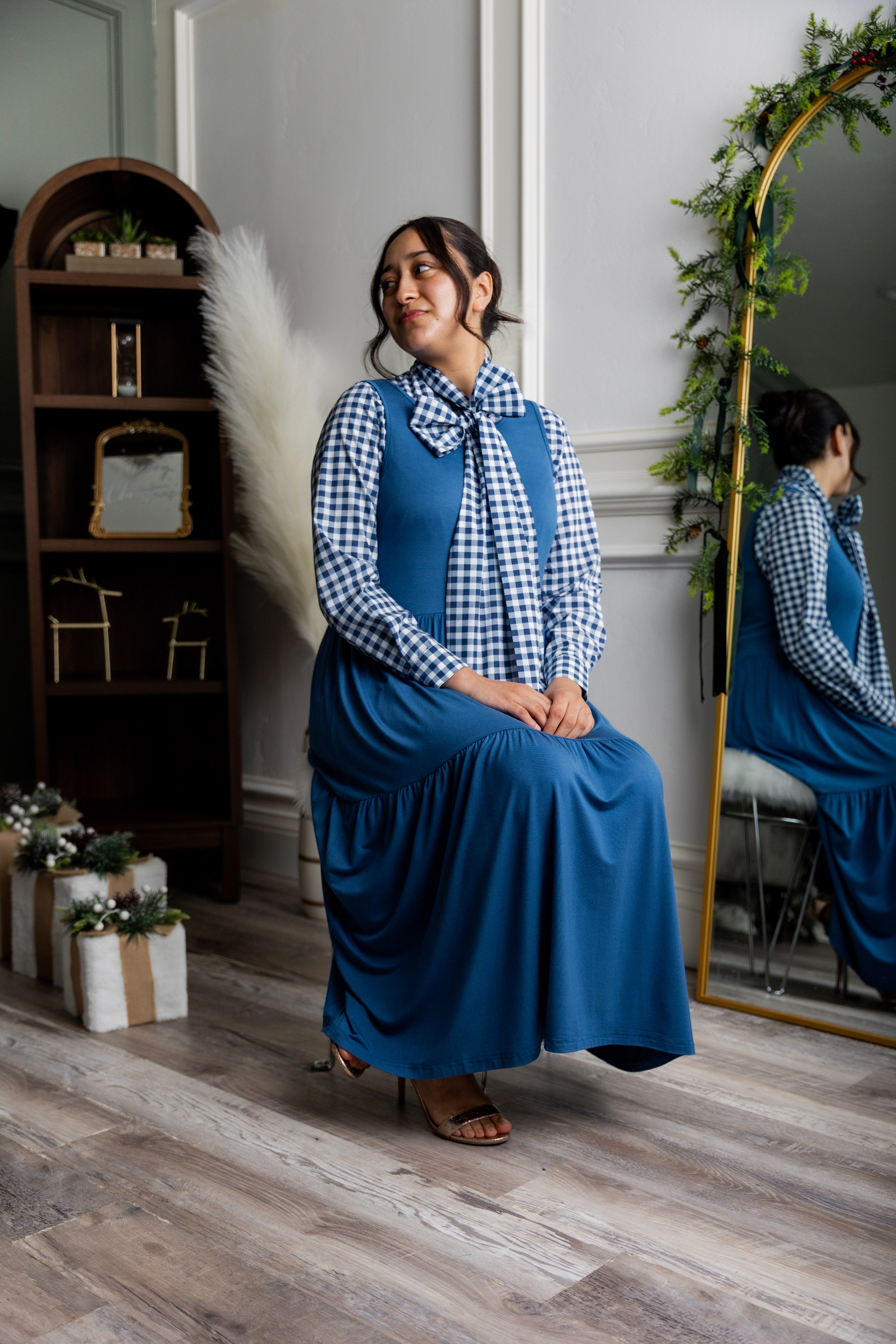 Model wearing Nuggles® Felicity top with large bow tie neckline, modest women's blouse.