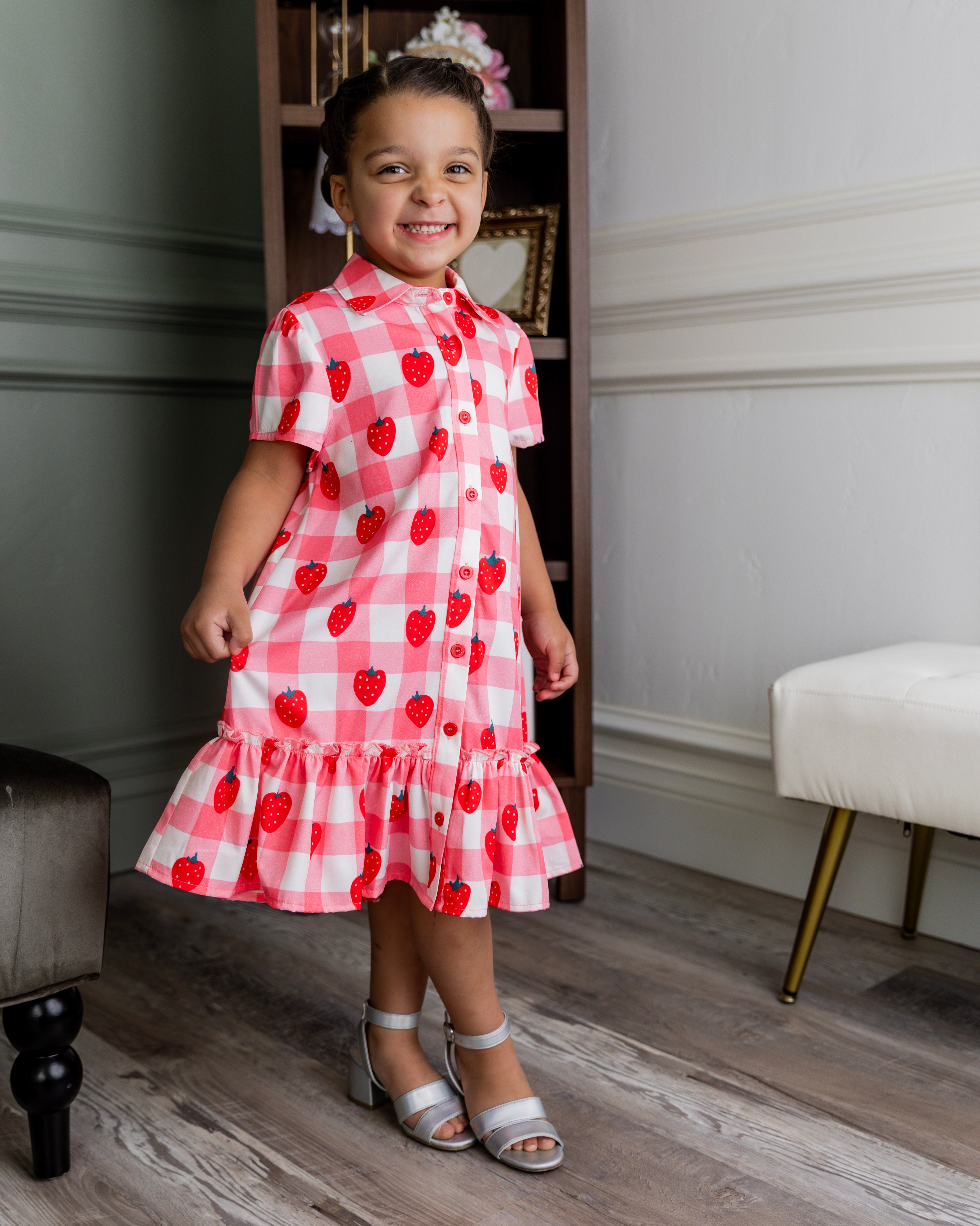 Model wearing Nuggles® Girls' Ellie Dress Dress in Strawberry Sweetheart