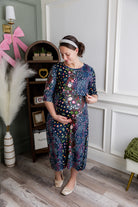 Model wearing Nuggles® Nalani Nursing Dress in Star Garden