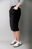 Model wearing Nuggles® 25-inch corduroy skirt