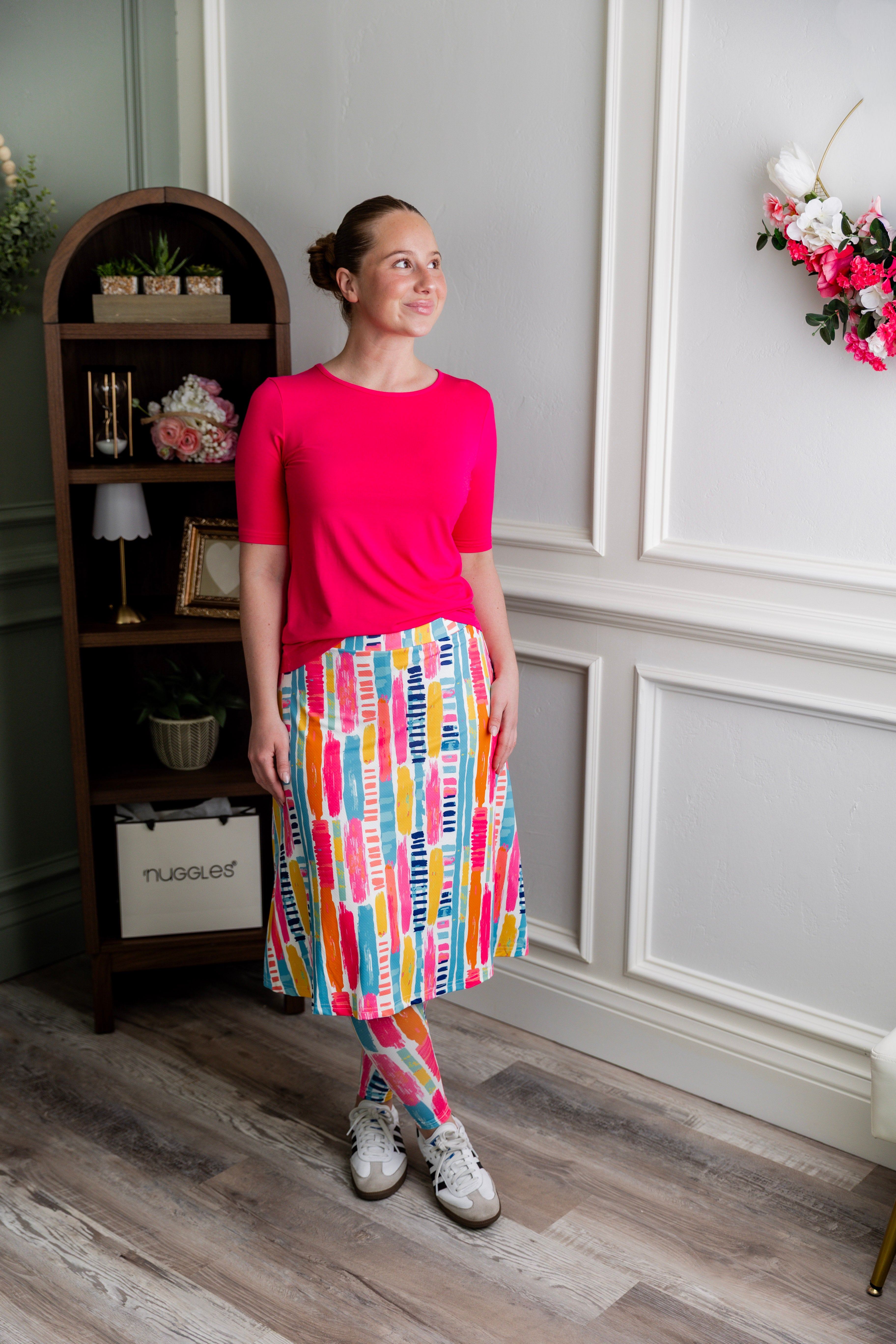 Model wearing Nuggles® Tilly Sport Skirt in Color Splash