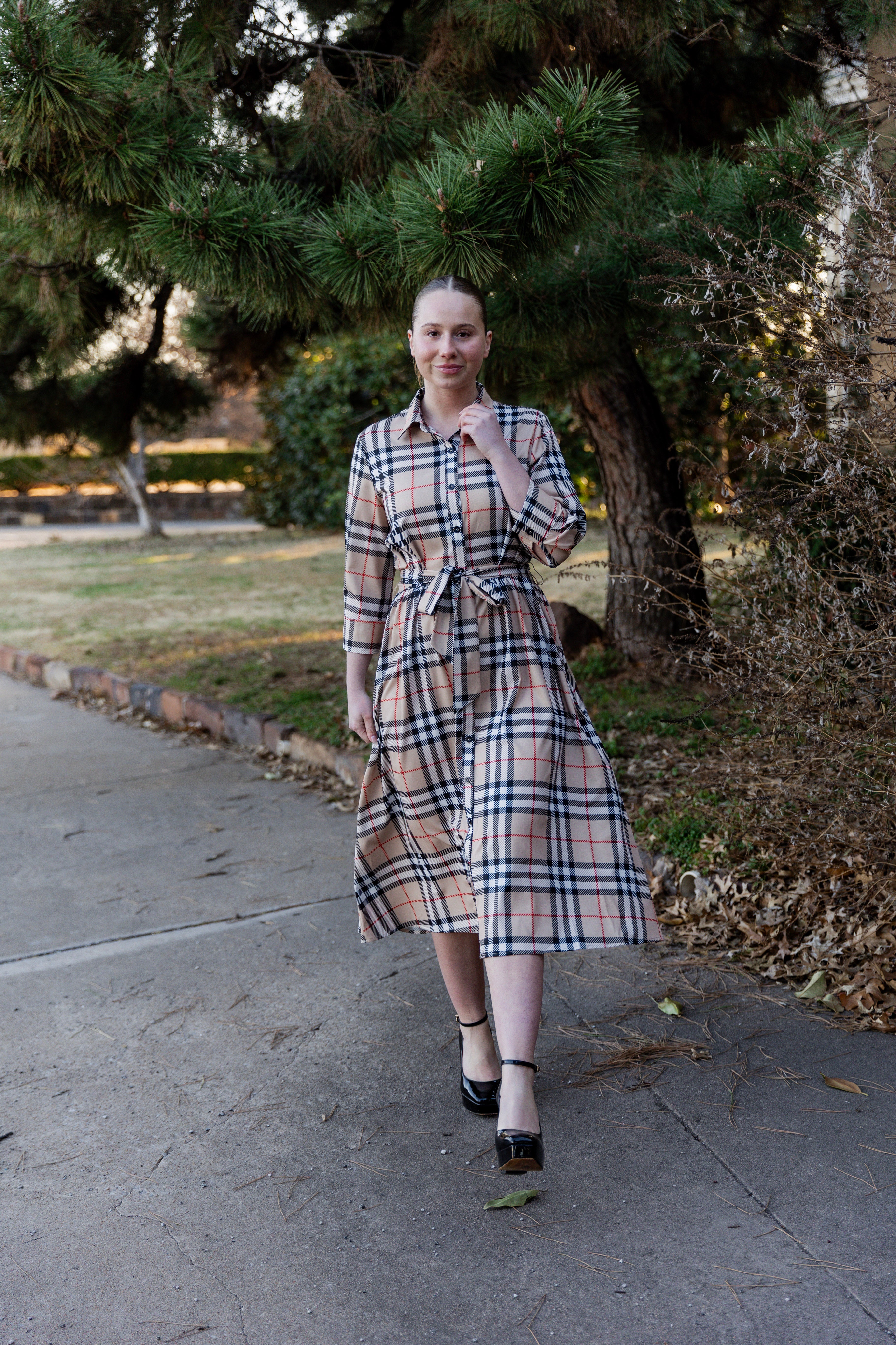 Model wearing the Nuggles® Rachel Dress in Sand Plaid