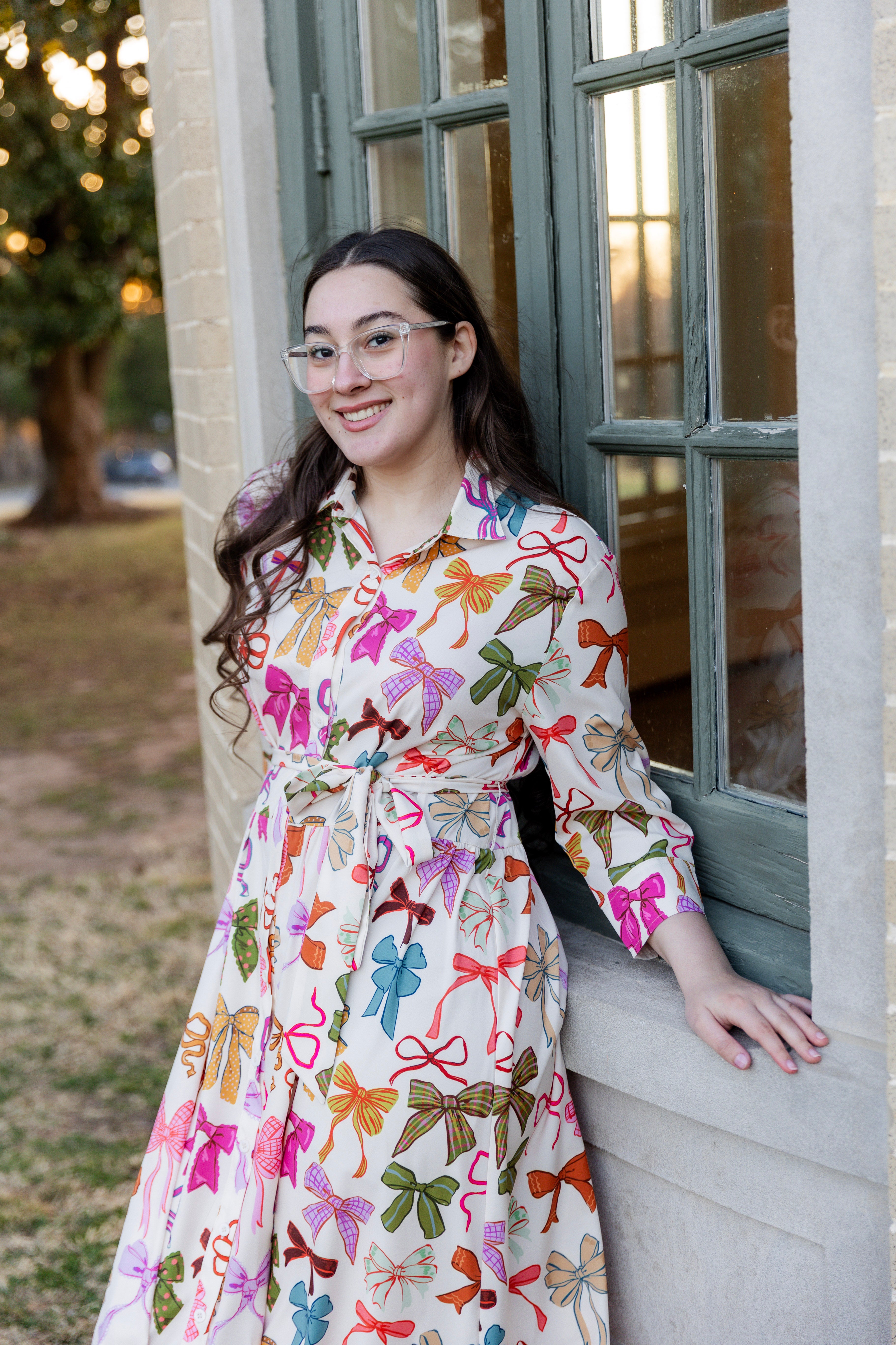 Model wearing the Nuggles® Rachel Dress in Bow Garden