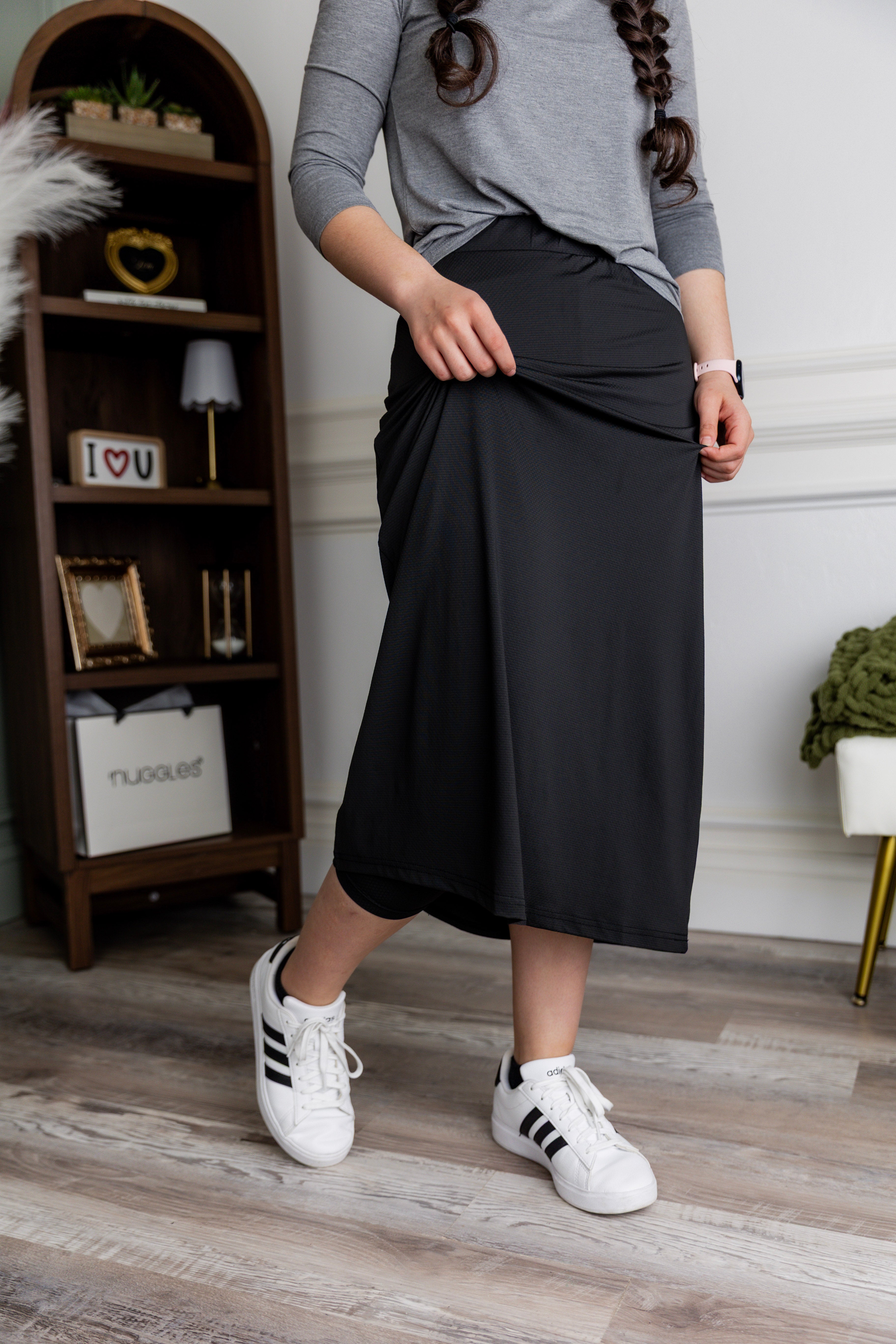 Model wearing Nuggles® 31" All-Sport Skirt in Black