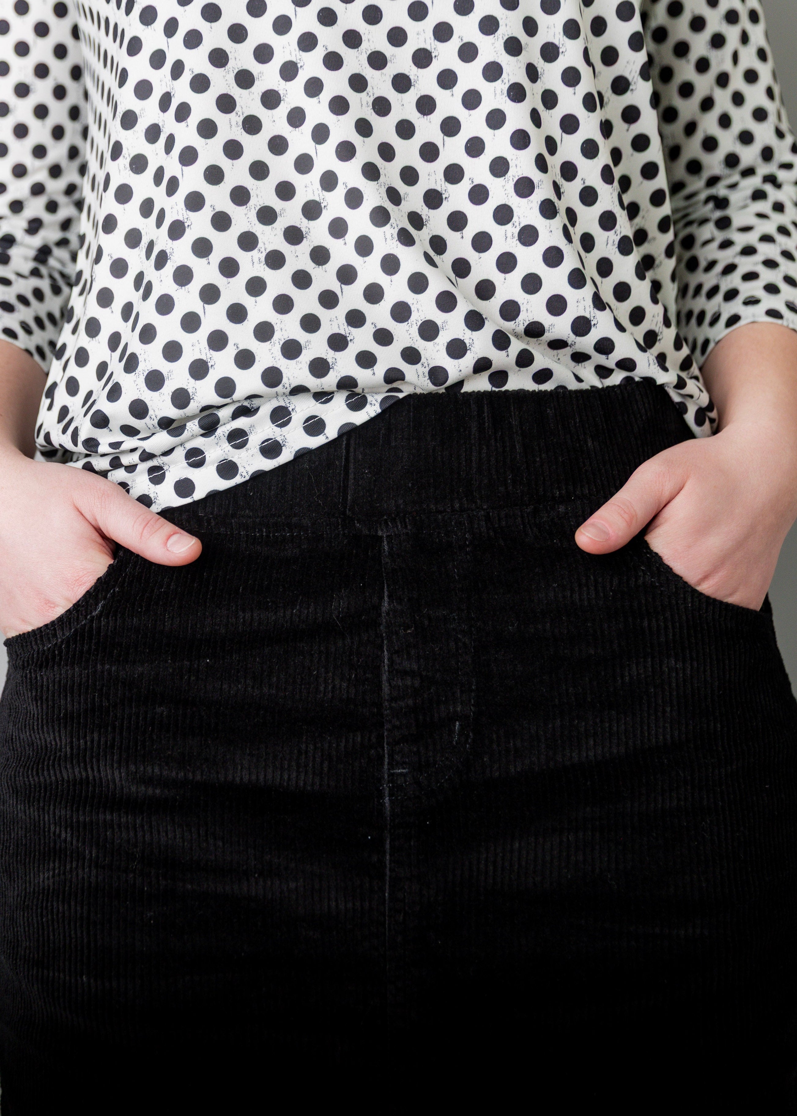 Model wearing Nuggles® 25-inch corduroy skirt