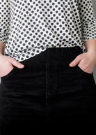 Model wearing Nuggles® 25-inch corduroy skirt