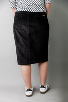Model wearing Nuggles® 25-inch corduroy skirt