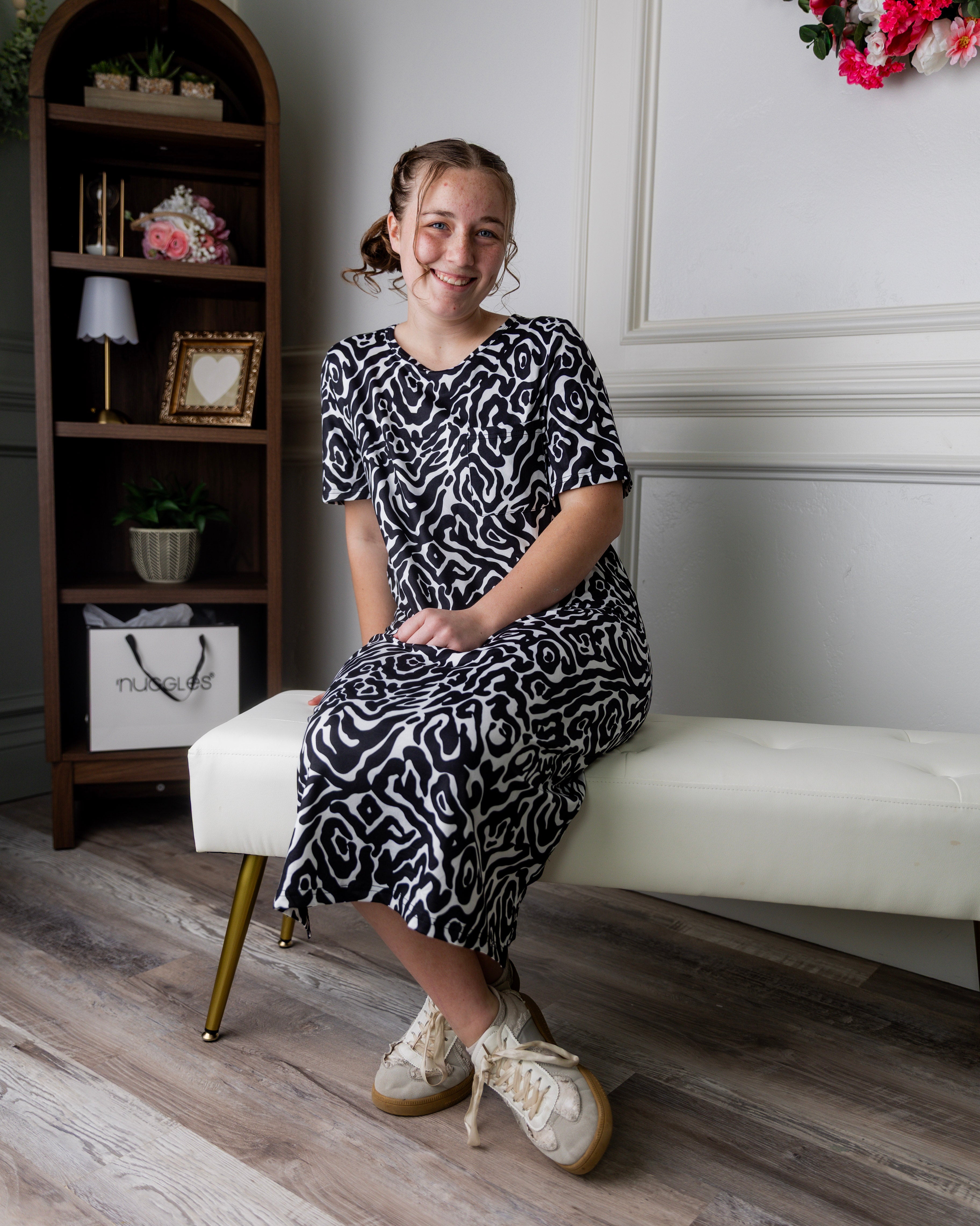 Model wearing Nuggles® Aviva Dress in Black Ink Bloom